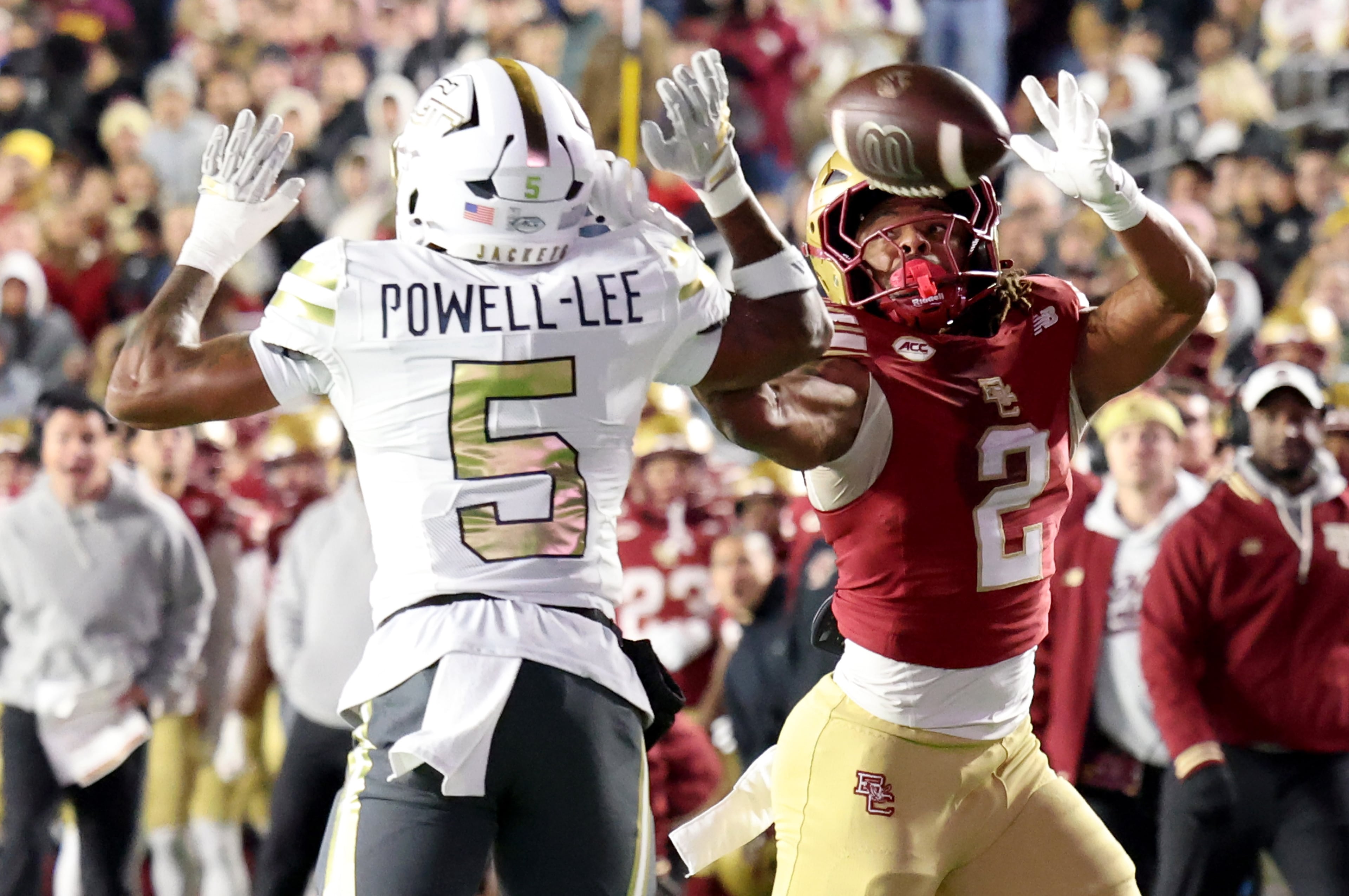 Boston College running back Turbo Richard (2) makes a failed attempt to catch the ball near Georgia Tech defensive back Clayton Powell-Lee (5) during the second half of an NCAA college football game Saturday, Nov. 15, 2025, in Boston. (AP Photo/Mark Stockwell)