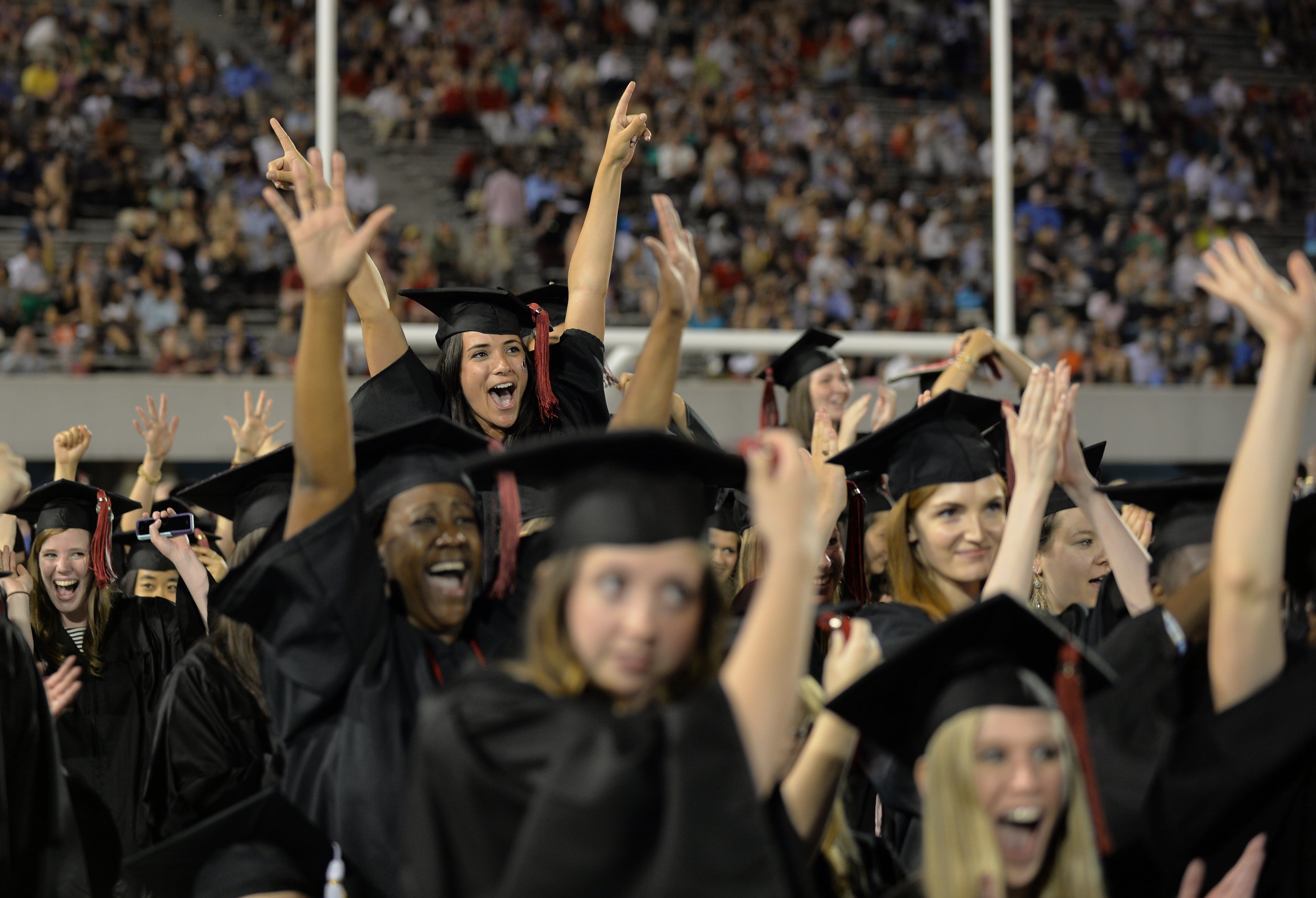 May 8, 2015 Athens, GA: University of Georgia students celebrate as their degrees are conferred during the undergraduate commencement at Sanford Stadium Friday May 8, 2015. Almost 4500 undergraduates had their degrees conferred during the ceremony. More than 1100 students received their Masters during a morning ceremony. Amy Robach , a 1995 alumna and news anchor for ABC's "Good Morning America" was the key note speaker. BRANT SANDERLIN/BSANDERLIN@AJC.COM
