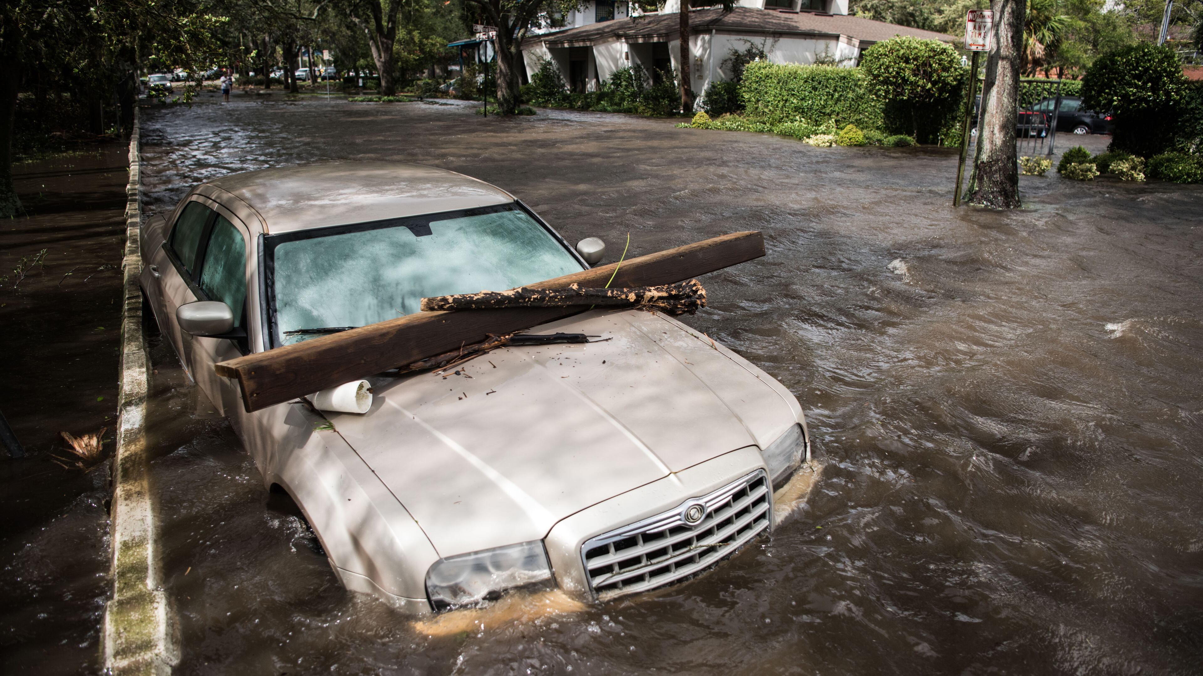 JACKSONVILLE, FL - SEPTEMBER 11: A vehicle is inundated by storm surge flood waters from Hurricane Irma along the St. Johns River on Sept. 11, 2017 in Jacksonville, Florida. Flooding in downtown Jacksonville along the river topped a record set during Hurricane Dora in 1965. (Photo by Sean Rayford/Getty Images)