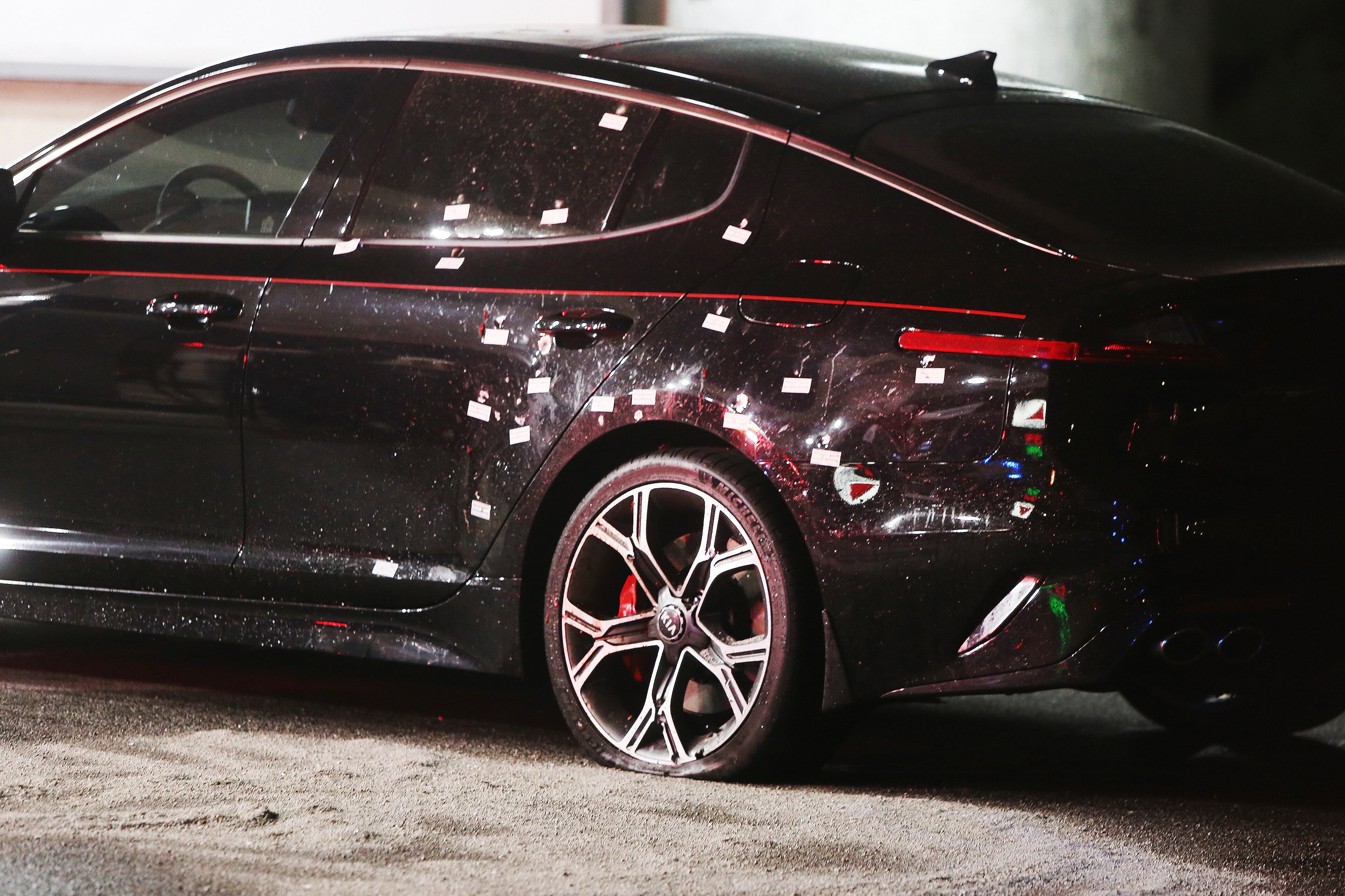 A black sedan was riddled with bullets at the scene of a fatal shooting at a Citgo gas station Wednesday.