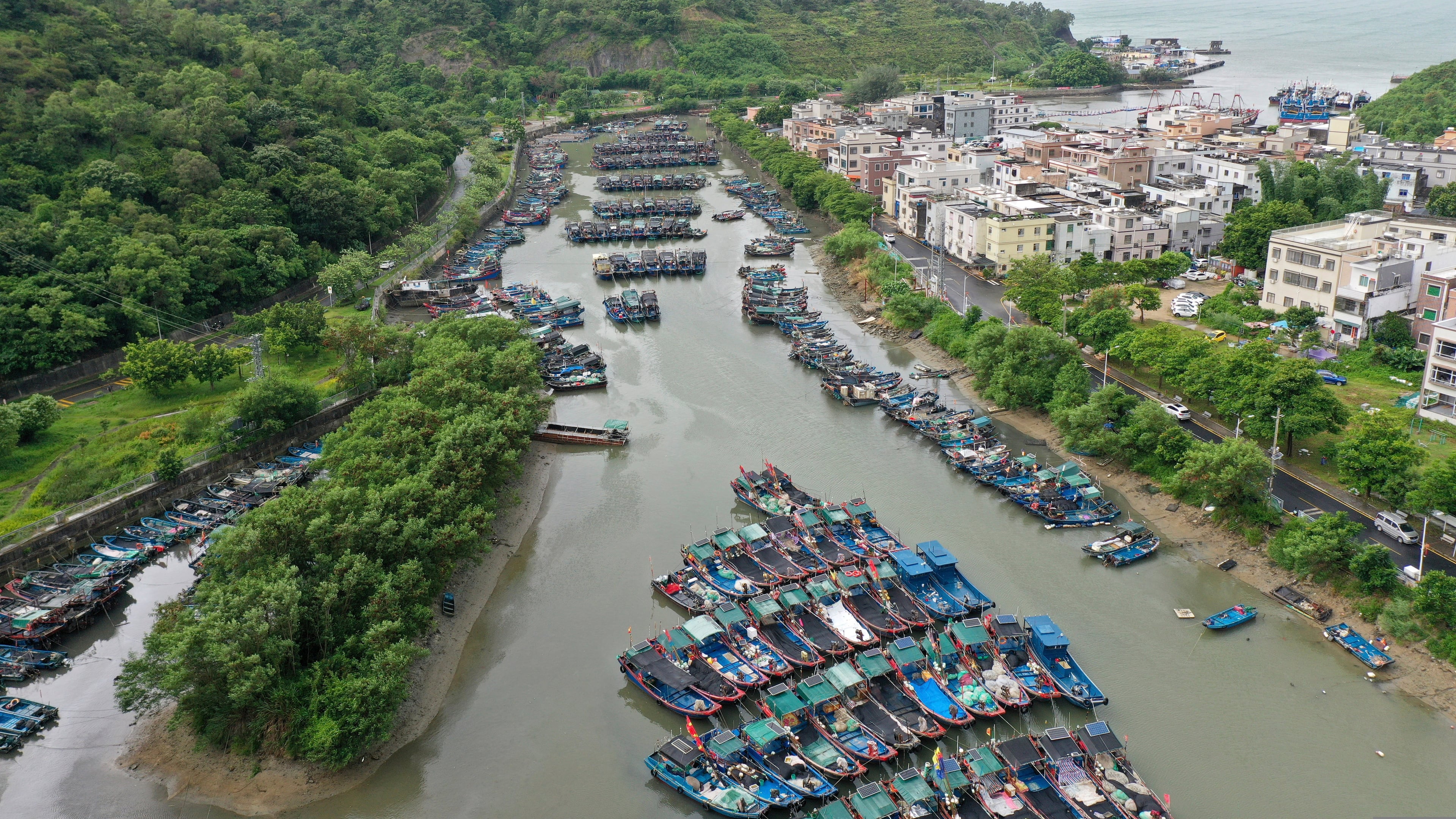 In this photo released by Xinhua News Agency, a drone photo shows fishing boats taking shelter ahead of Typhoon Noul at a port in Shenzhen-Shanwei Special Cooperation Zone in southern China's Guangdong Province on Saturday, July 25, 2026. (Lu Hanxin/Xinhua via AP)
