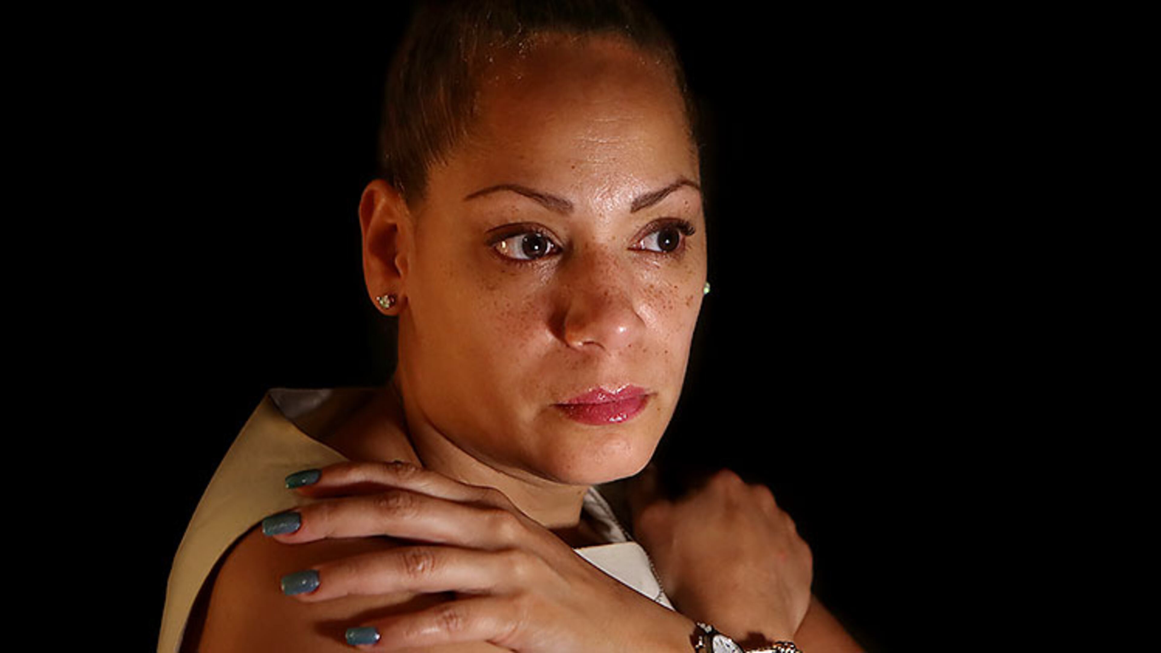 Sherr-una (Sheri) Booker poses for a portrait at her home in Loganville. Prior to surgery for cancer, doctors implanted a filter in her bloodstream to catch clots. Several years later the device that was supposed to protect her had broken up, and she had to have open-heart surgery.