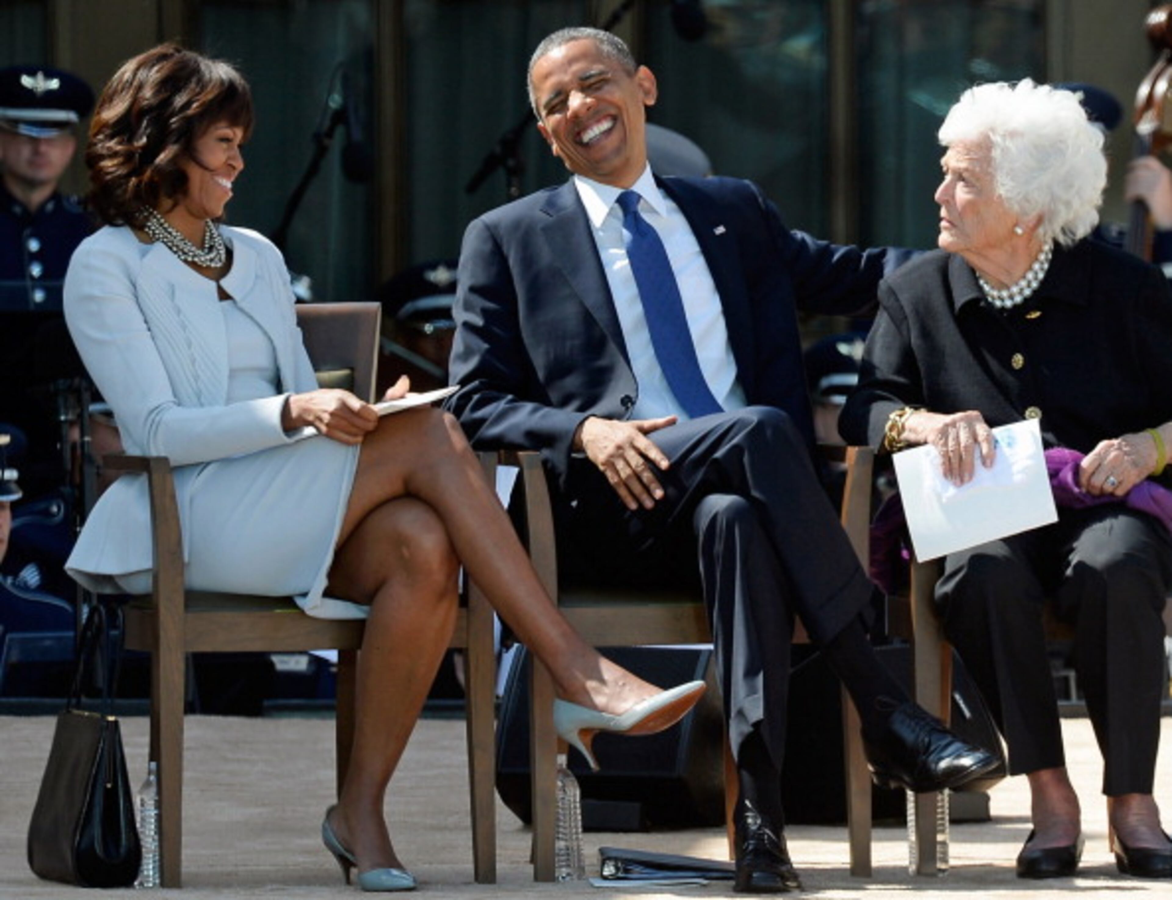 DALLAS, TX - APRIL 25: President Barack Obama (C) laughs with his wife first lady Michelle Obama (L) and former first lady Barbara Bush during the opening ceremony of the George W. Bush Presidential Center April 25, 2013 in Dallas, Texas. The Bush library, which is located on the campus of Southern Methodist University, with more than 70 million pages of paper records, 43,000 artifacts, 200 million emails and four million digital photographs, will be opened to the public on May 1, 2013. The library is the 13th presidential library in the National Archives and Records Administration system. (Photo by Kevork Djansezian/Getty Images)