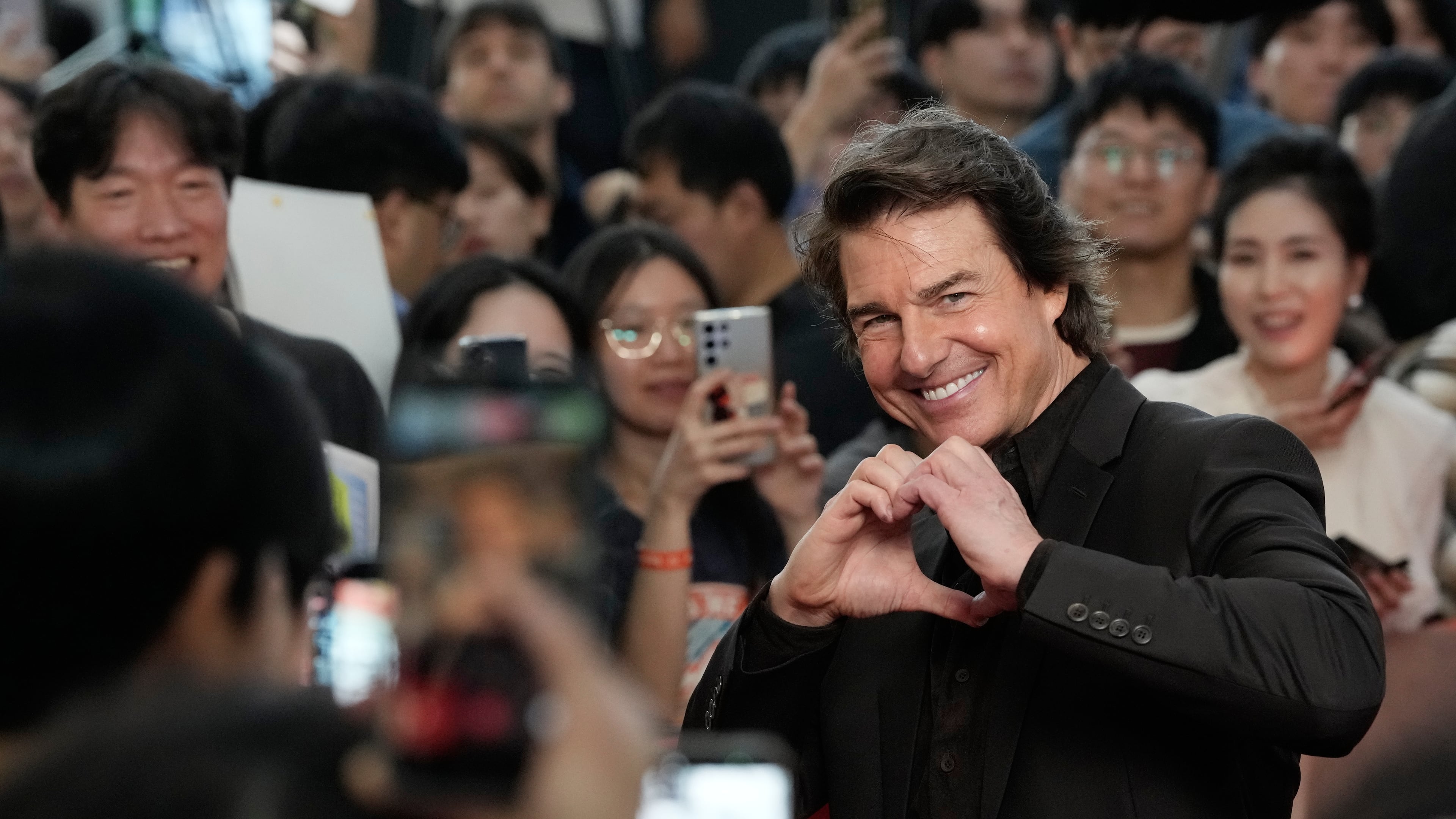 Tom Cruise poses during a red carpet event to promote "Digger" in Seoul, South Korea on Friday, Oct. 2, 2026. (Ahn Young-joon/AP)