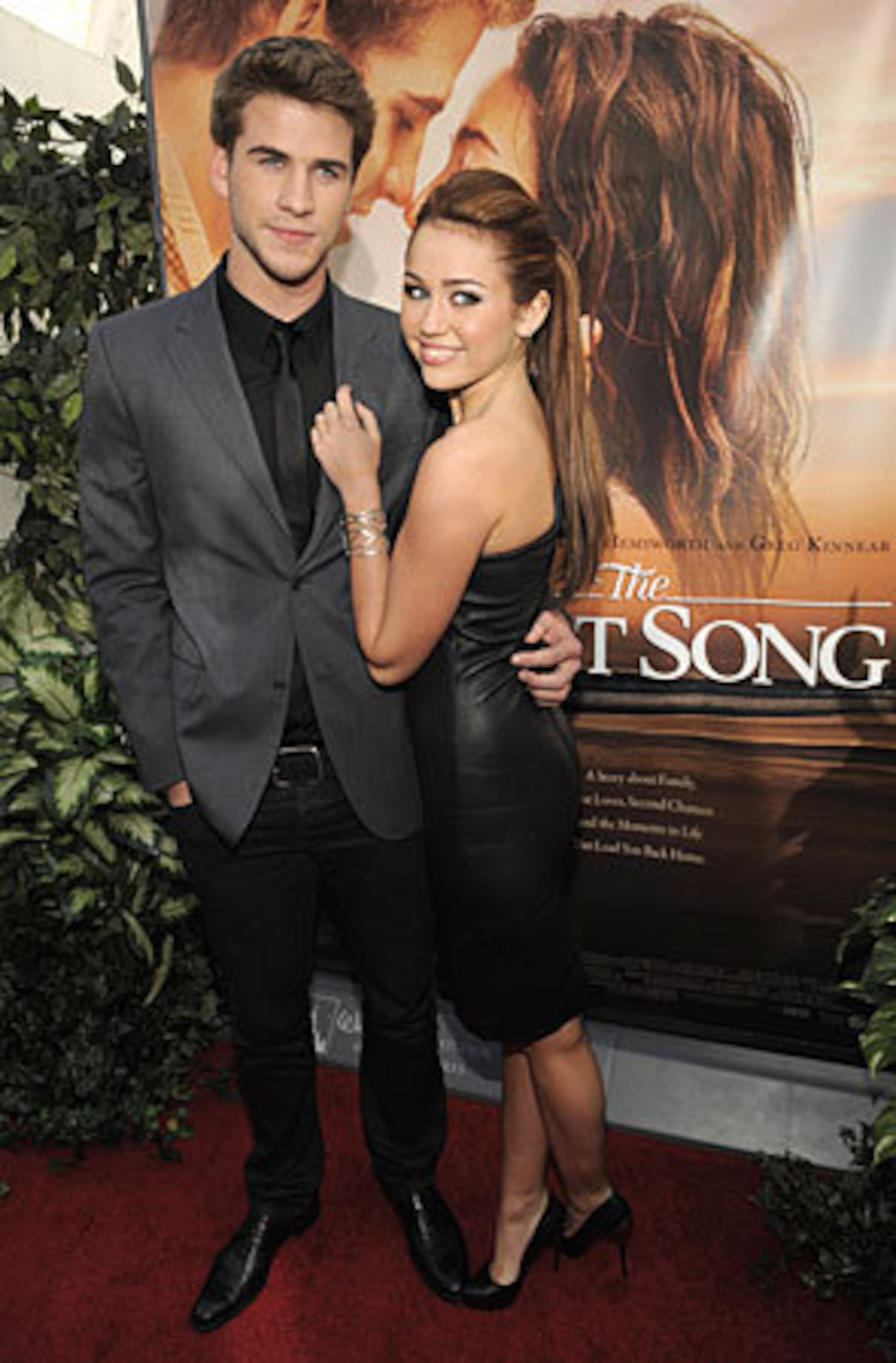 Miley Cyrus, right, and Liam Hemsworth, co-stars of "The Last Song, " pose together at the premiere of the film in Los Angeles, Thursday, March 25.
