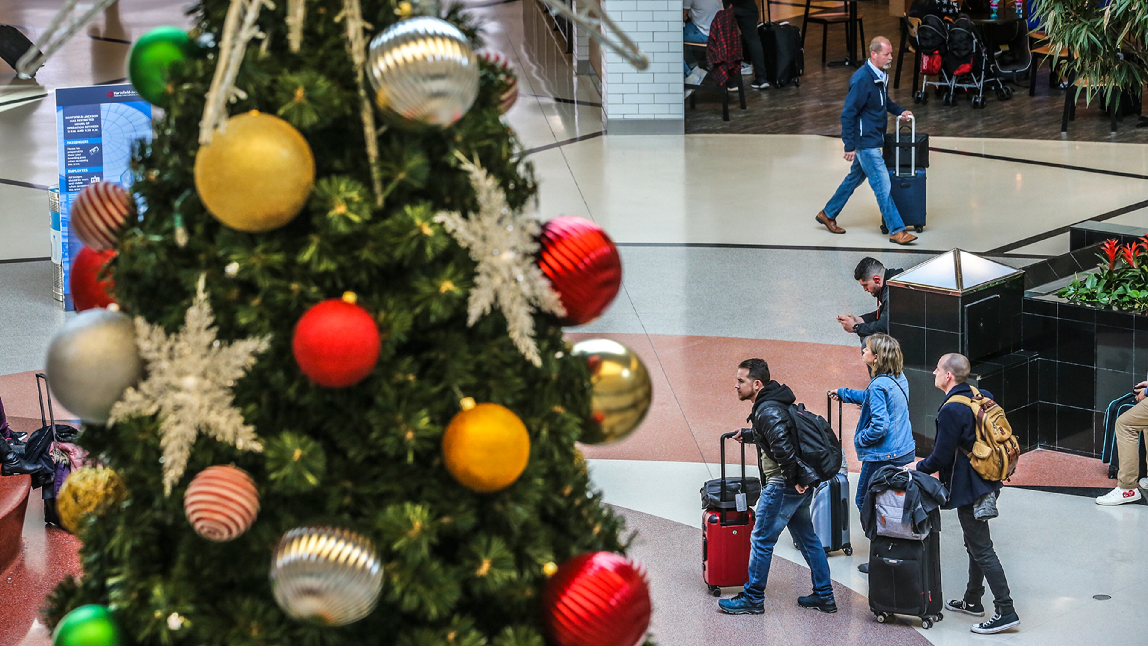 A holiday-bedecked domestic atrium greets travelers at Hartsfield-Jackson International Airport in Atlanta on Friday, November 22, 2019. (Photo: JOHN SPINK/JSPINK@AJC.COM)