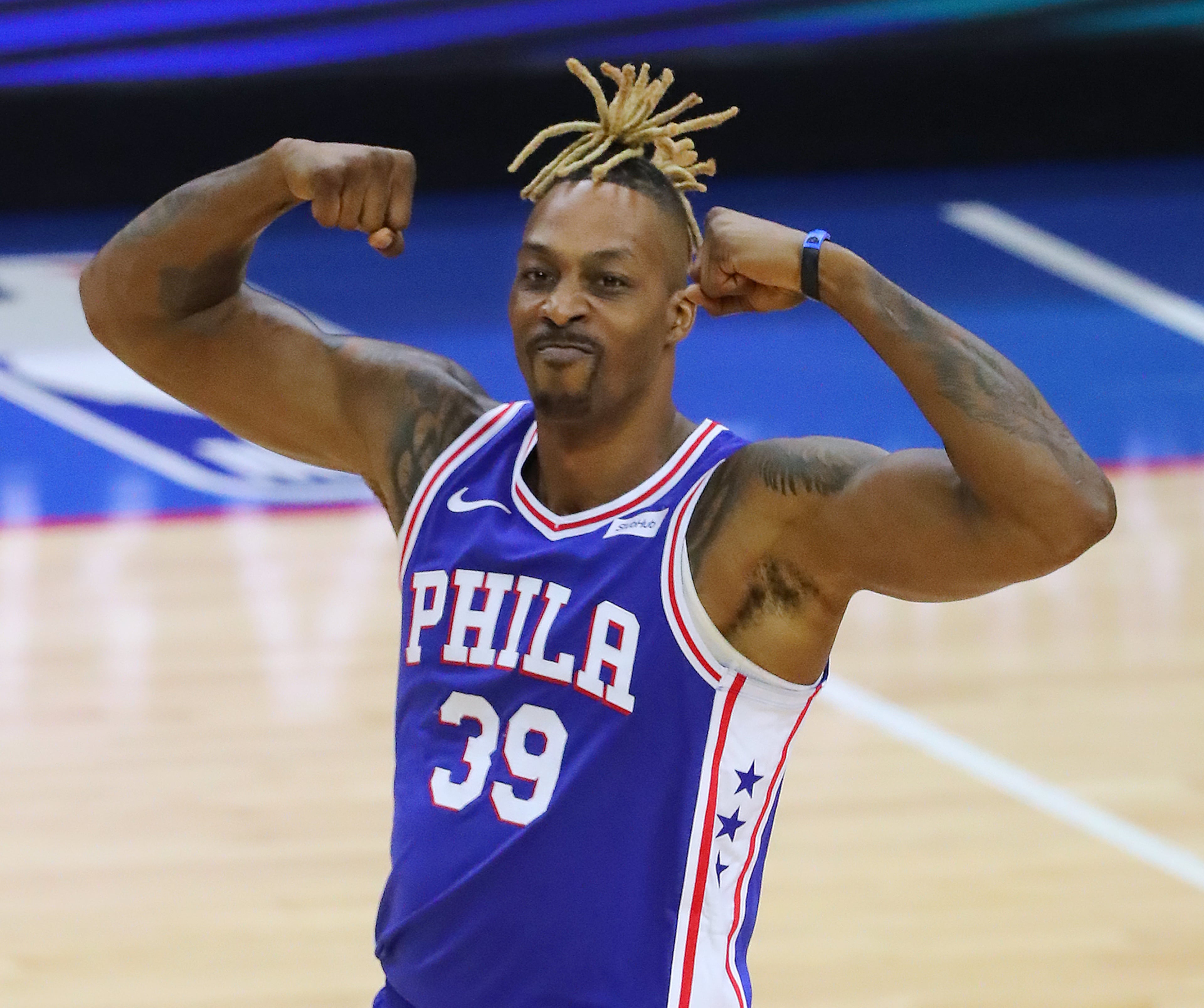 Philadelphia 76ers center Dwight Howard flexes after scoring against the Atlanta Hawks. “Curtis Compton / Curtis.Compton@ajc.com”