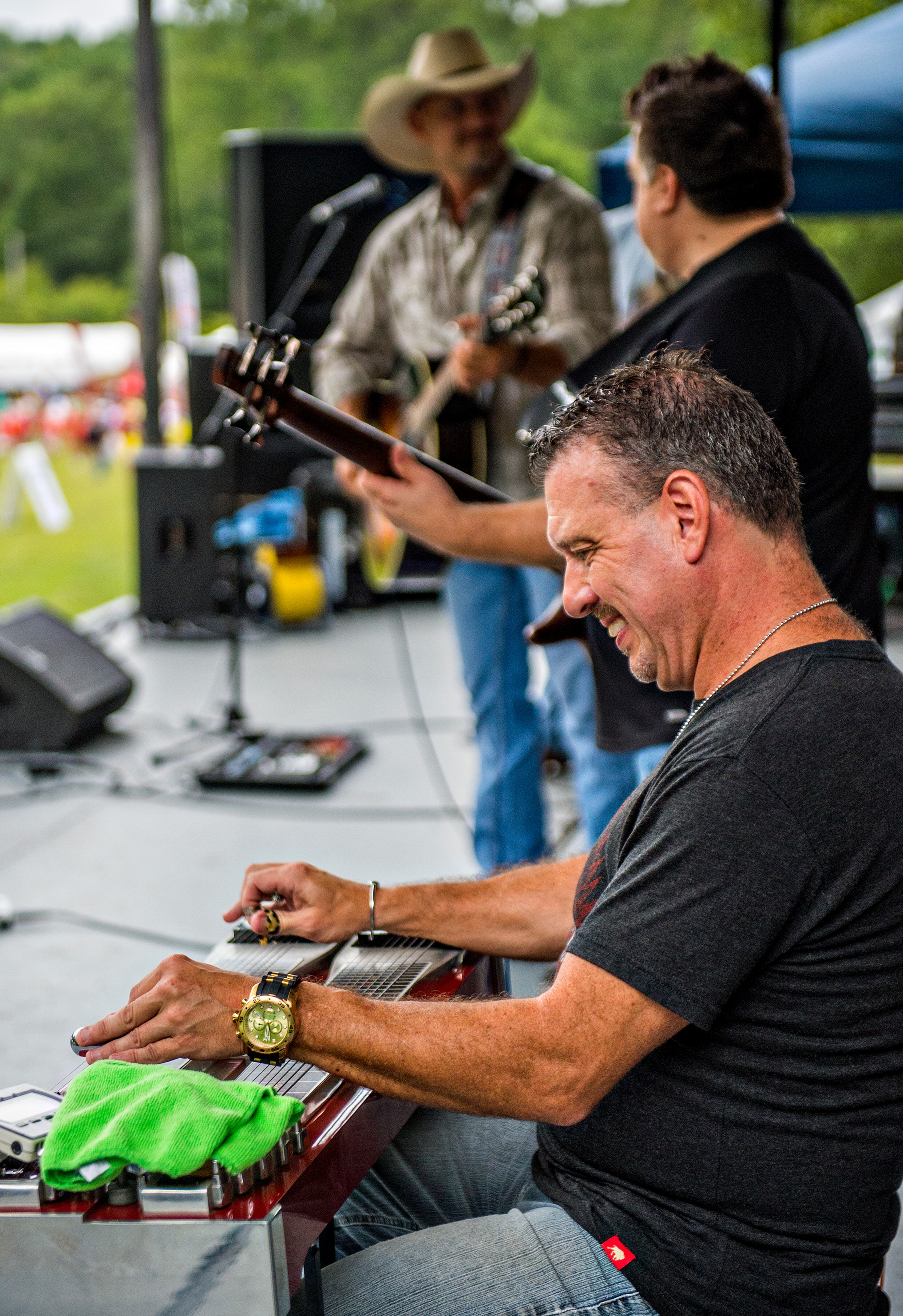 September 12, 2015 Stone Mountain - Across the Wide's Tim Hamilton (right), and Kevin Wyglad and Jody Abernathy perform on stage during the Yellow Daisy Festival at Stone Mountain Park on Saturday, September 12, 2015. In its 47th year, the festival features more than 400 artists from all over the country over four days. JONATHAN PHILLIPS / SPECIAL