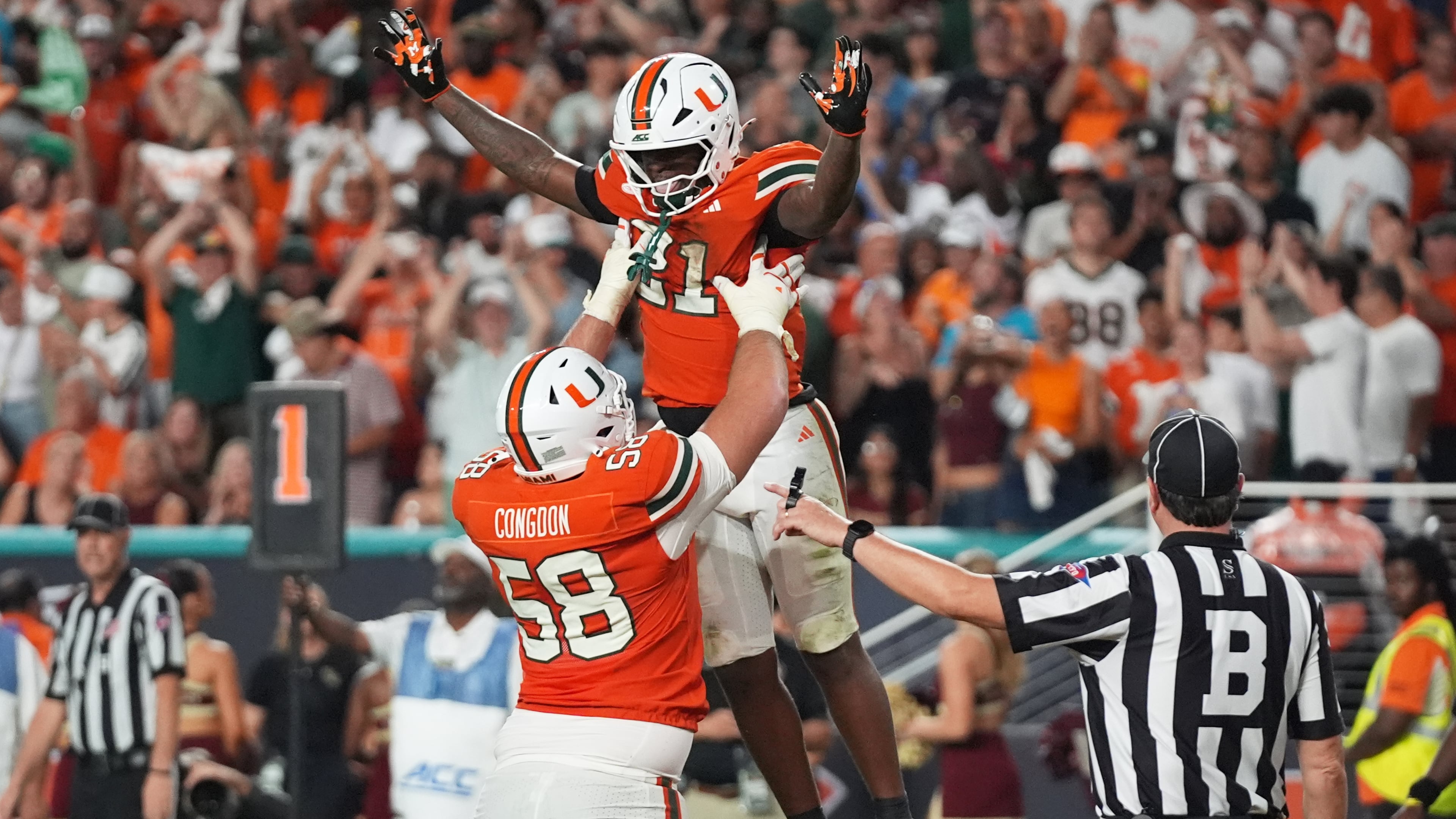 Miami running back Javian Mallory (top) celebrates with offensive lineman Ben Congdon after scoring a touchdown during the second half against Florida State on Saturday, Oct. 17, 2026, in Miami Gardens, Florida. The third-ranked Hurricanes won 43-35 in double overtime and should take over the No. 1 spot in the AP Top 25 with No. 1 Georgia and No. 2 Notre Dame losing. (Lynne Sladky/AP)