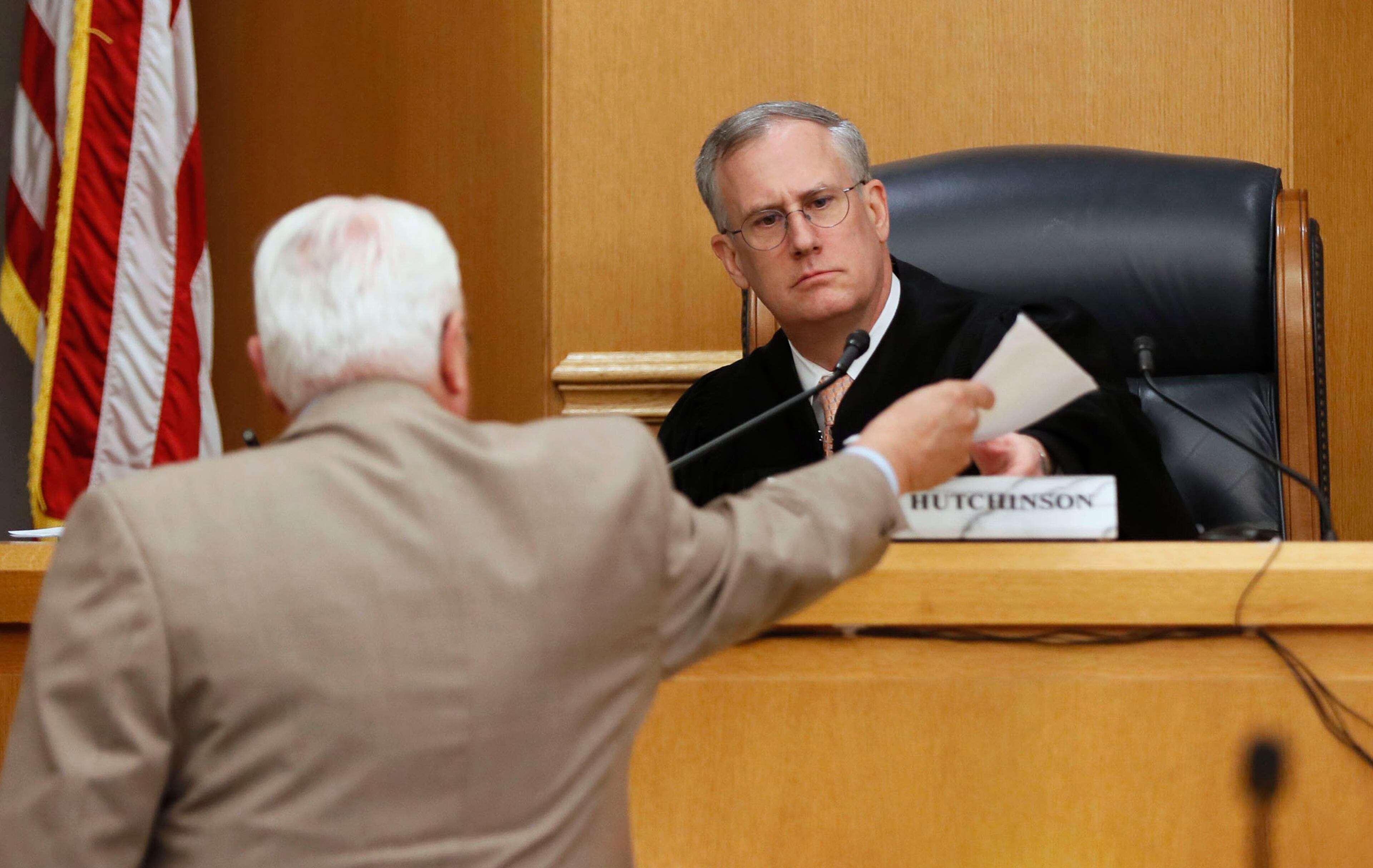 April 30, 2019 - Lawrenceville - Judge George Hutchinson receives the jury's verdict from the bailiff. The jury in the Tiffany Moss murder trial today sentenced her to death after they found Moss, who is representing herself, guilty of intentionally starving her 10-year-old stepdaughter Emani to death in the fall of 2013, in addition to other charges. The prosecution is asking for the death penalty. Bob Andres / bandres@ajc.com