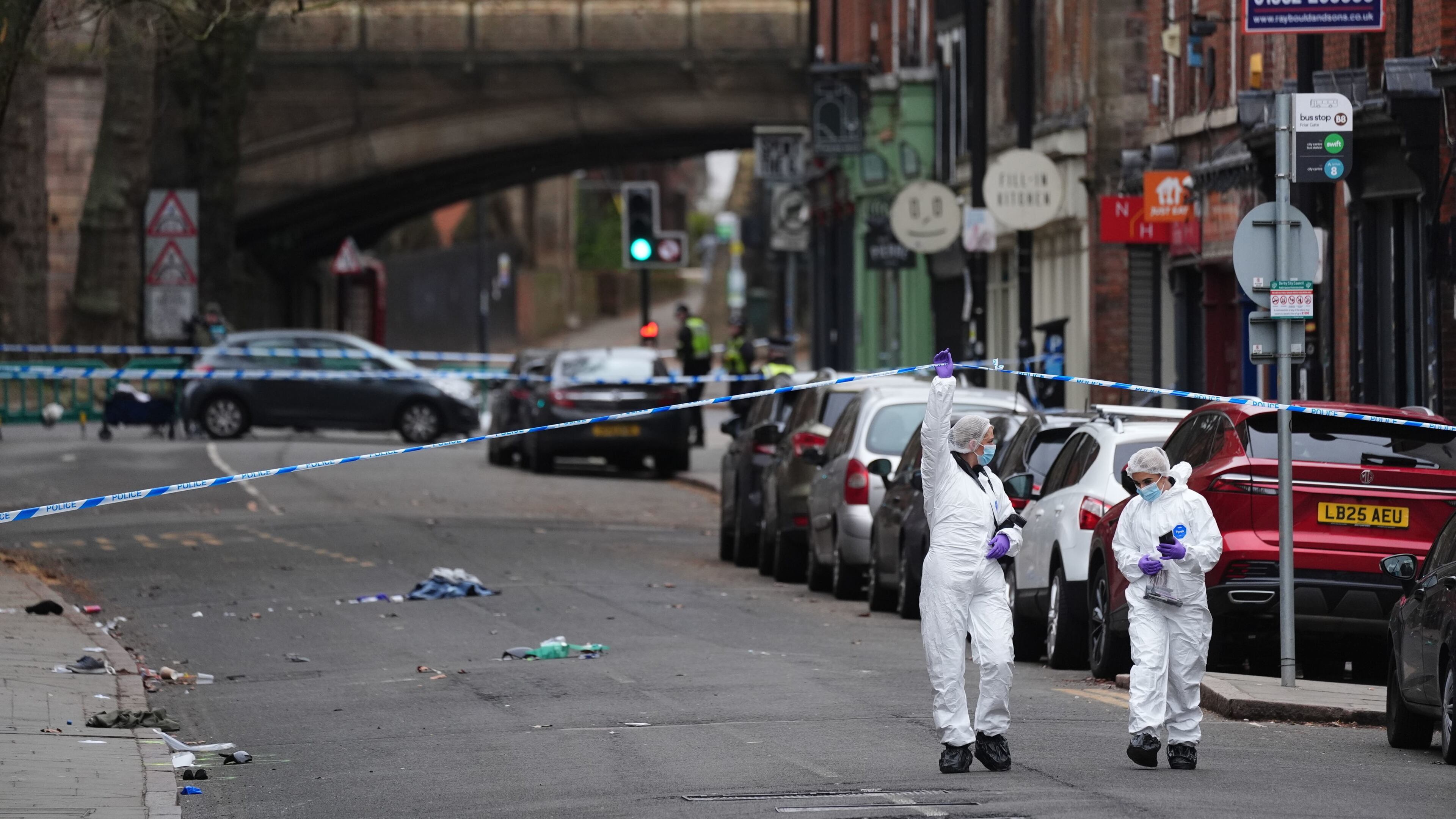 Forensic investigators work on the scene in Friar Gate, Derby, Sunday March 29, 2026, where a number of people had been injured, some of them seriously, after being hit by a car in the city centre on Saturday night. (Jacob King/PA via AP)