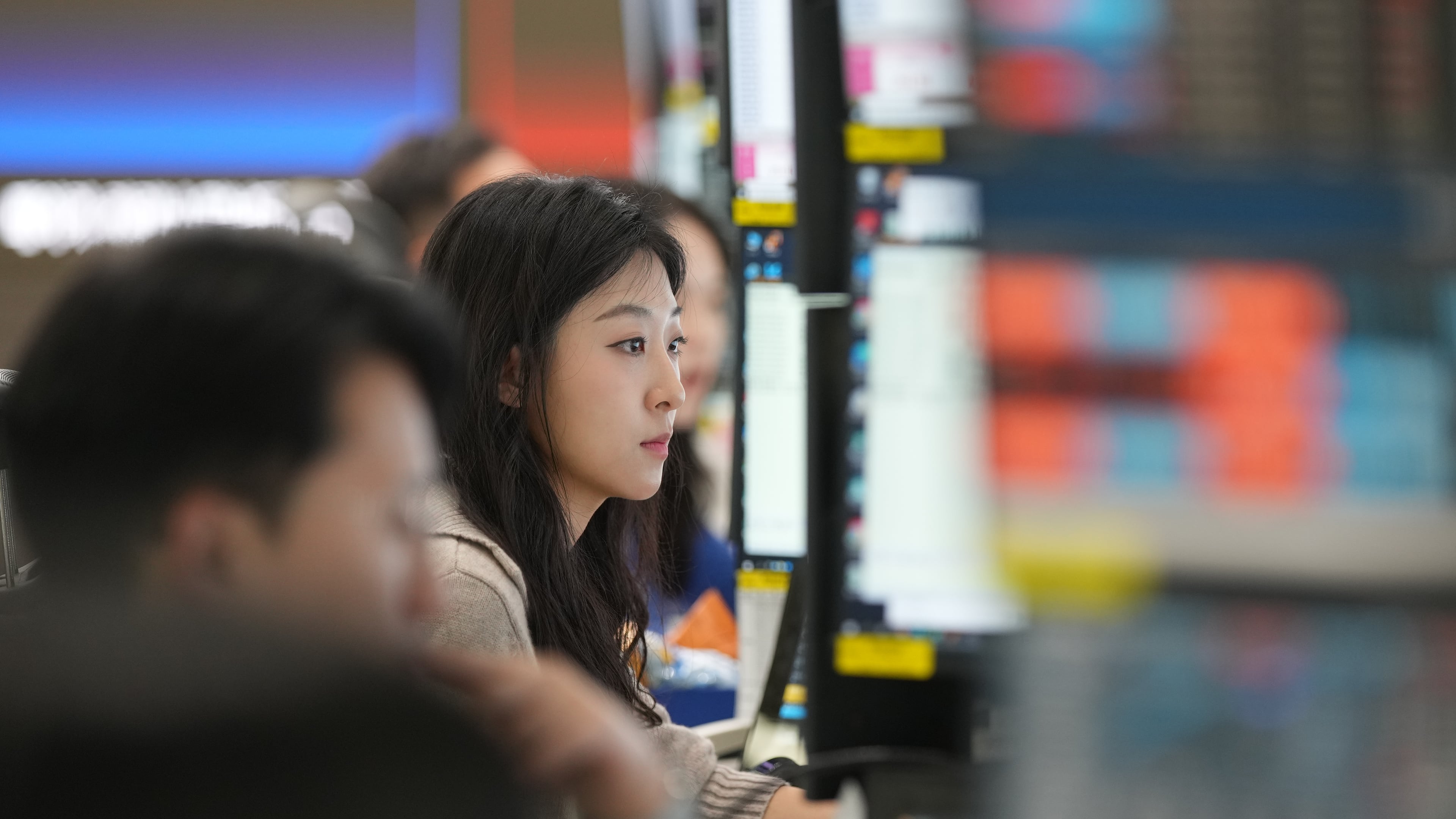 A dealer watches computer monitors at a dealing room of Hana Bank in Seoul, South Korea, Friday, May 8, 2026. (AP Photo/Lee Jin-man)