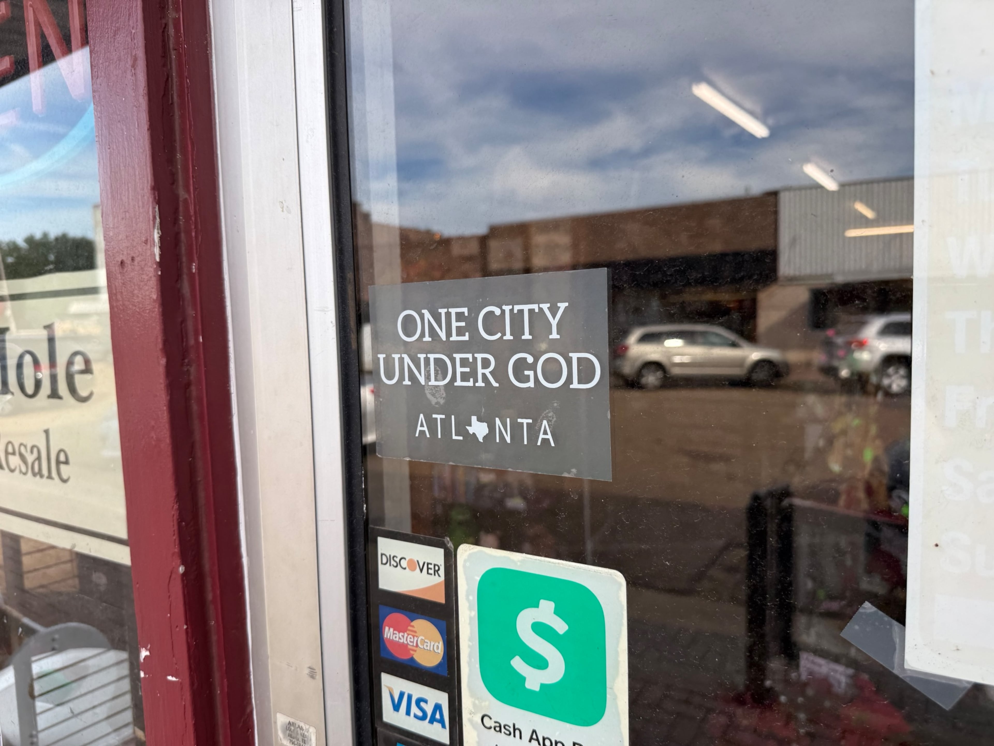 A doorway in downtown Atlanta, Texas, a city of roughly 5,400 people inspired partly by Georgia’s capital. (Greg Bluestein/AJC)