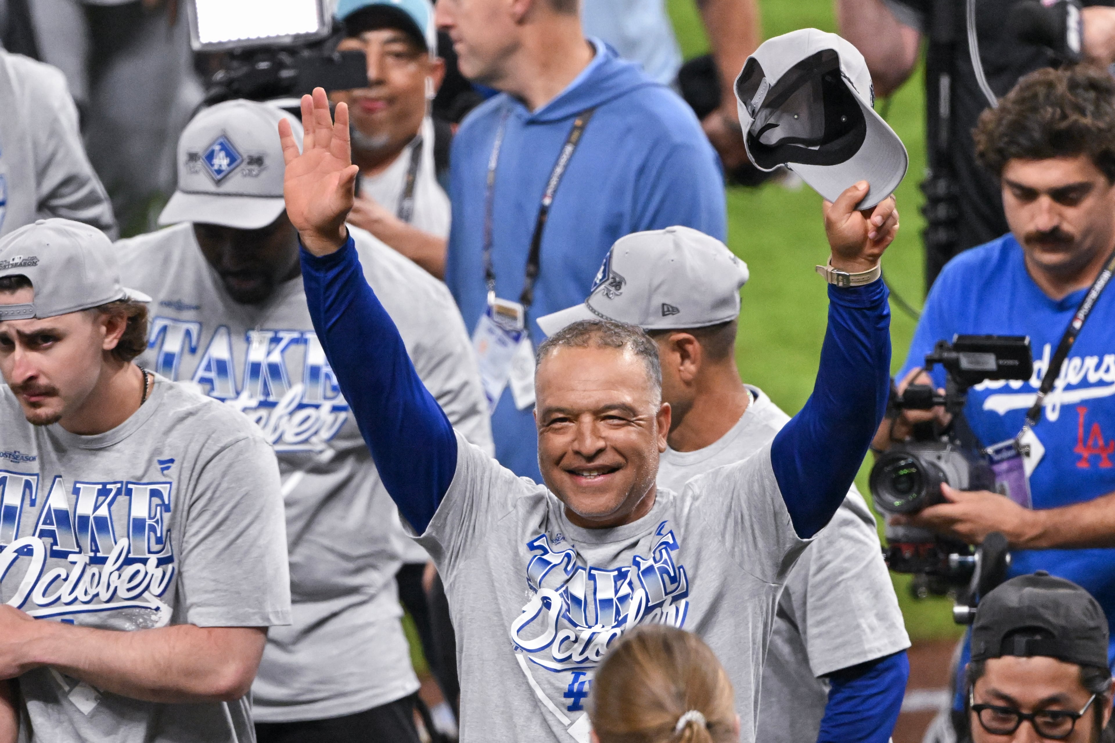 Los Angeles Dodgers manager Dave Roberts celebrates with the team after defeating the Atlanta Braves in Game 4 of the MLB National League Division Series between the Atlanta Braves and the Los Angeles Dodgers, Wednesday, Oct. 7, 2026, in Atlanta. The Dodgers defeated the Braves 3 games to 1. (Hyosub Shin/AJC)