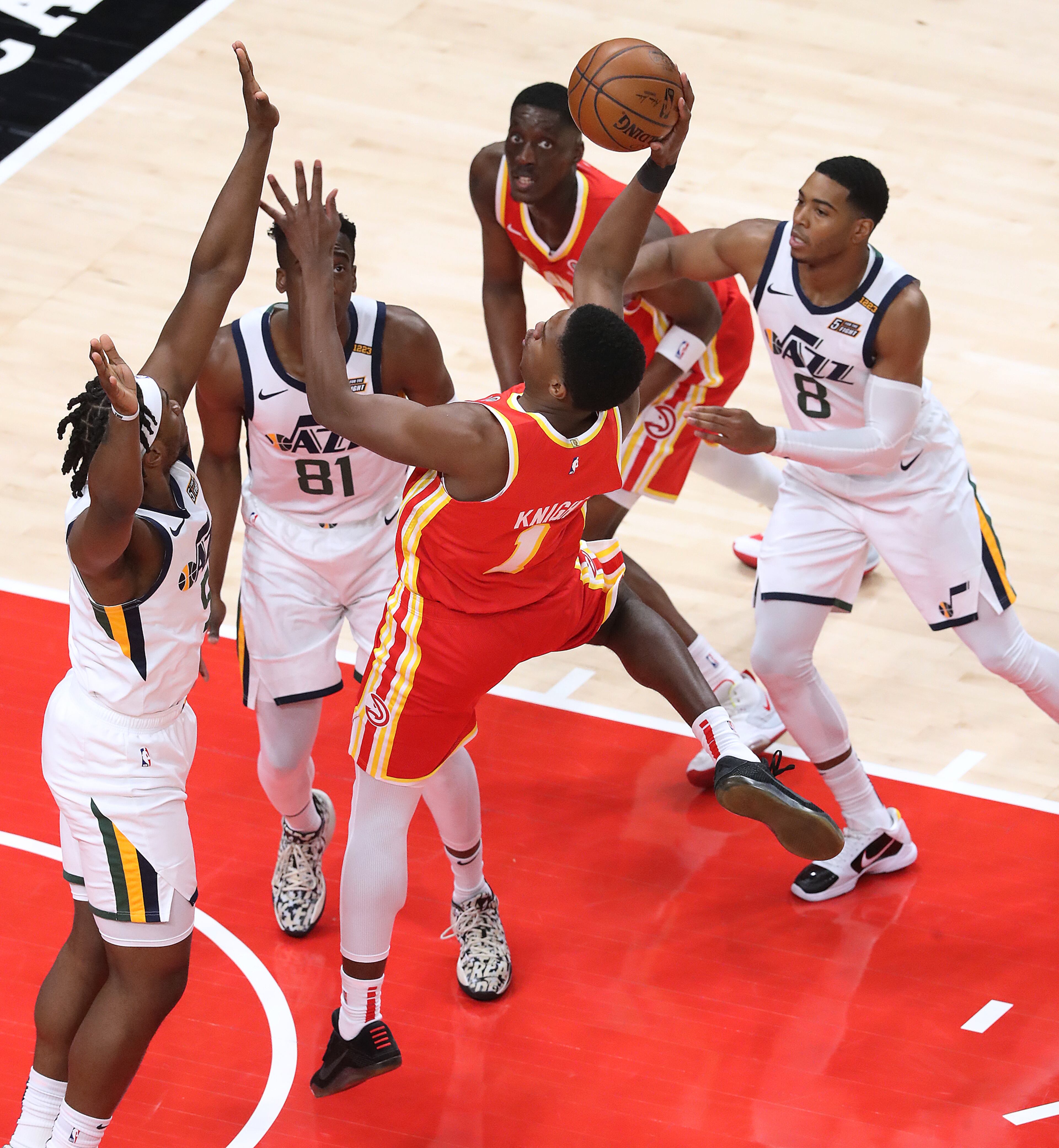 Atlanta Hawks forward Nathan Knight is triple teamed going to the basket against the Utah Jazz in an NBA basketball game on Thursday, Feb 4, 2021, in Atlanta. Curtis Compton / Curtis.Compton@ajc.com”
