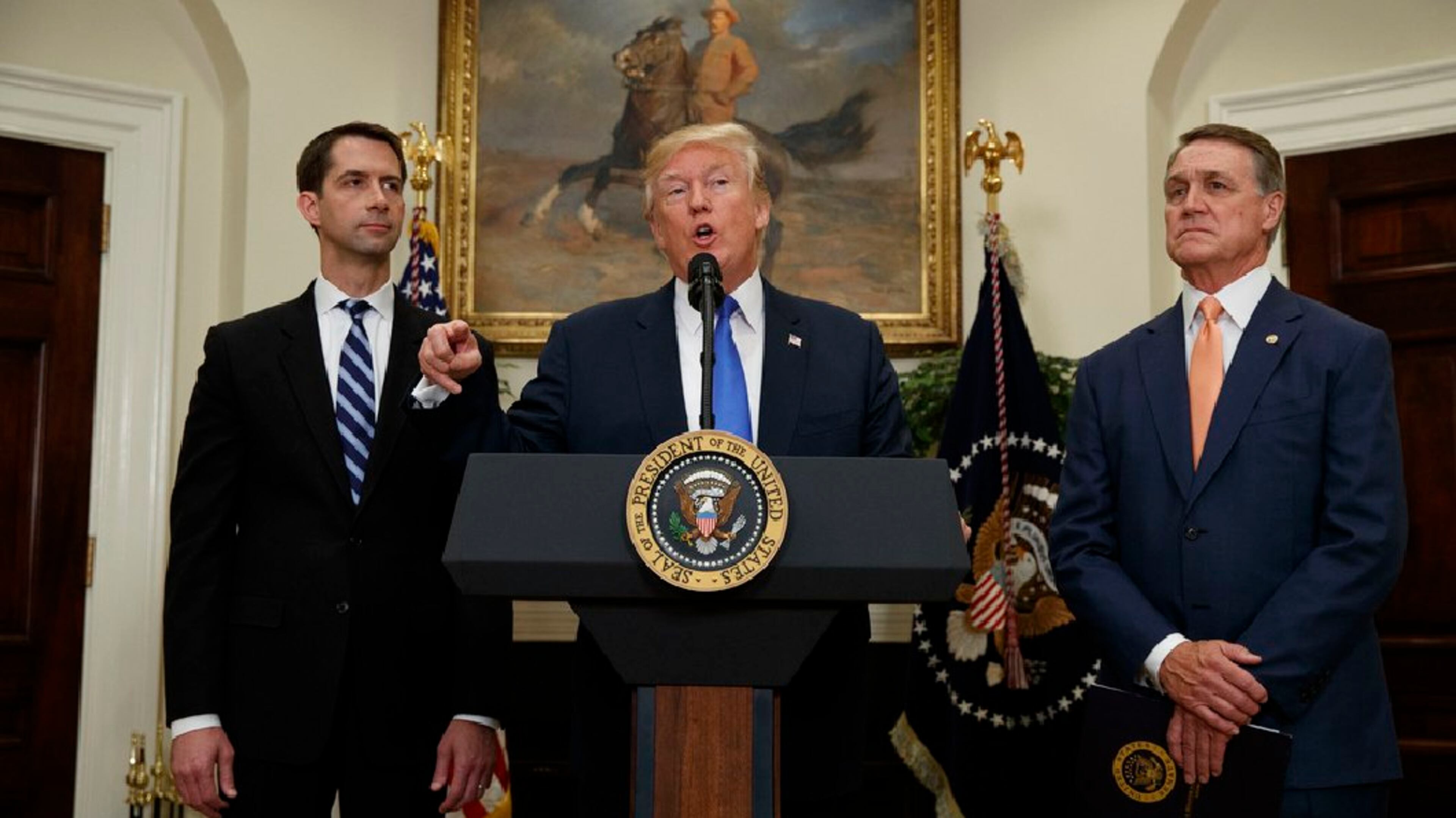 President Trump, center, with U.S. Sen. Tom Cotton, left, and U.S. Sen. David Perdue of Georgia. (AP)