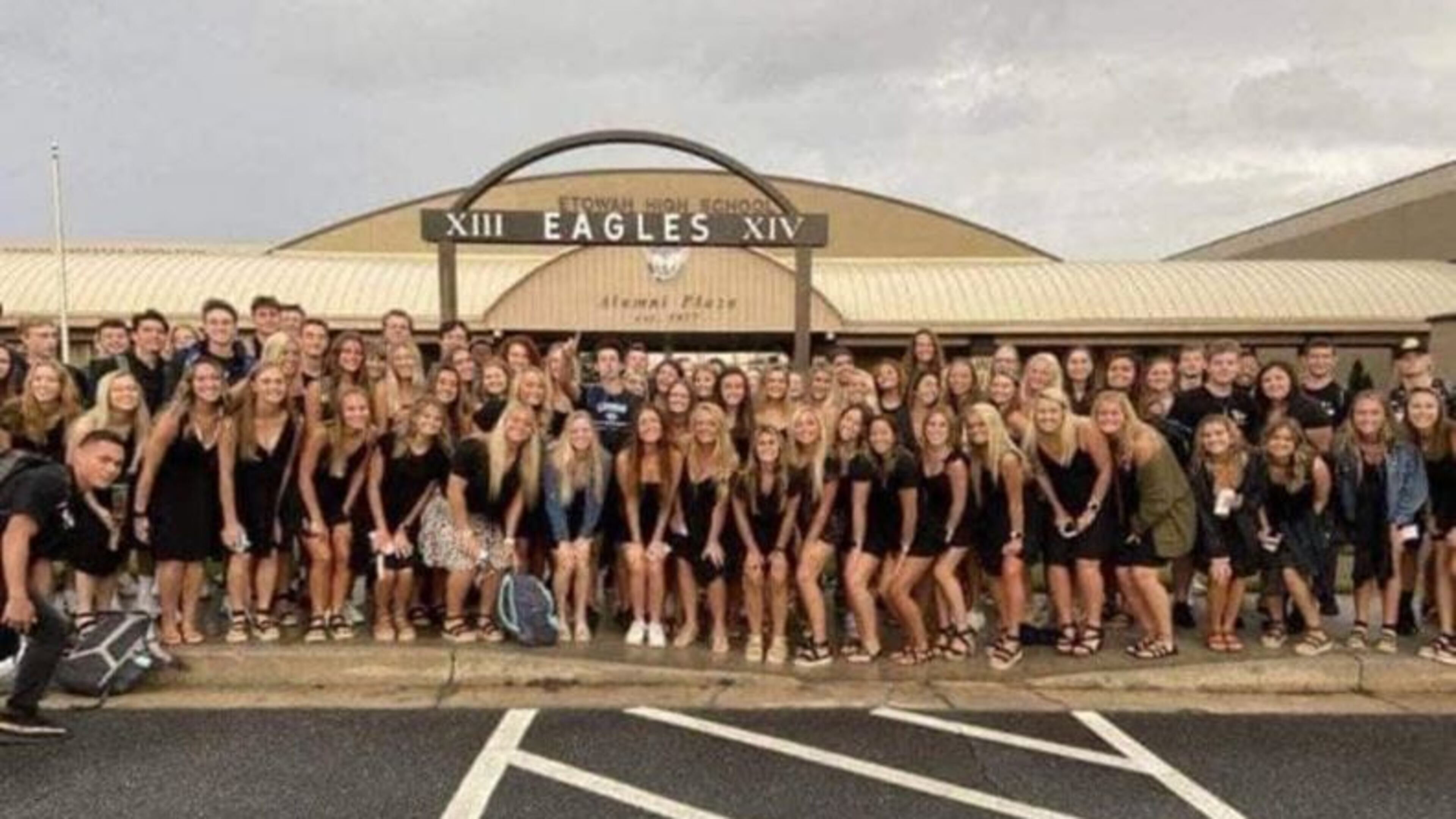 Seniors at Etowah High School in Cherokee County posed for the traditional color-coordinated senior photo on Aug, 3, 2020, the first day back to classes in the COVID era. The photo went viral because the students are not wearing masks and crowded together for the shot.