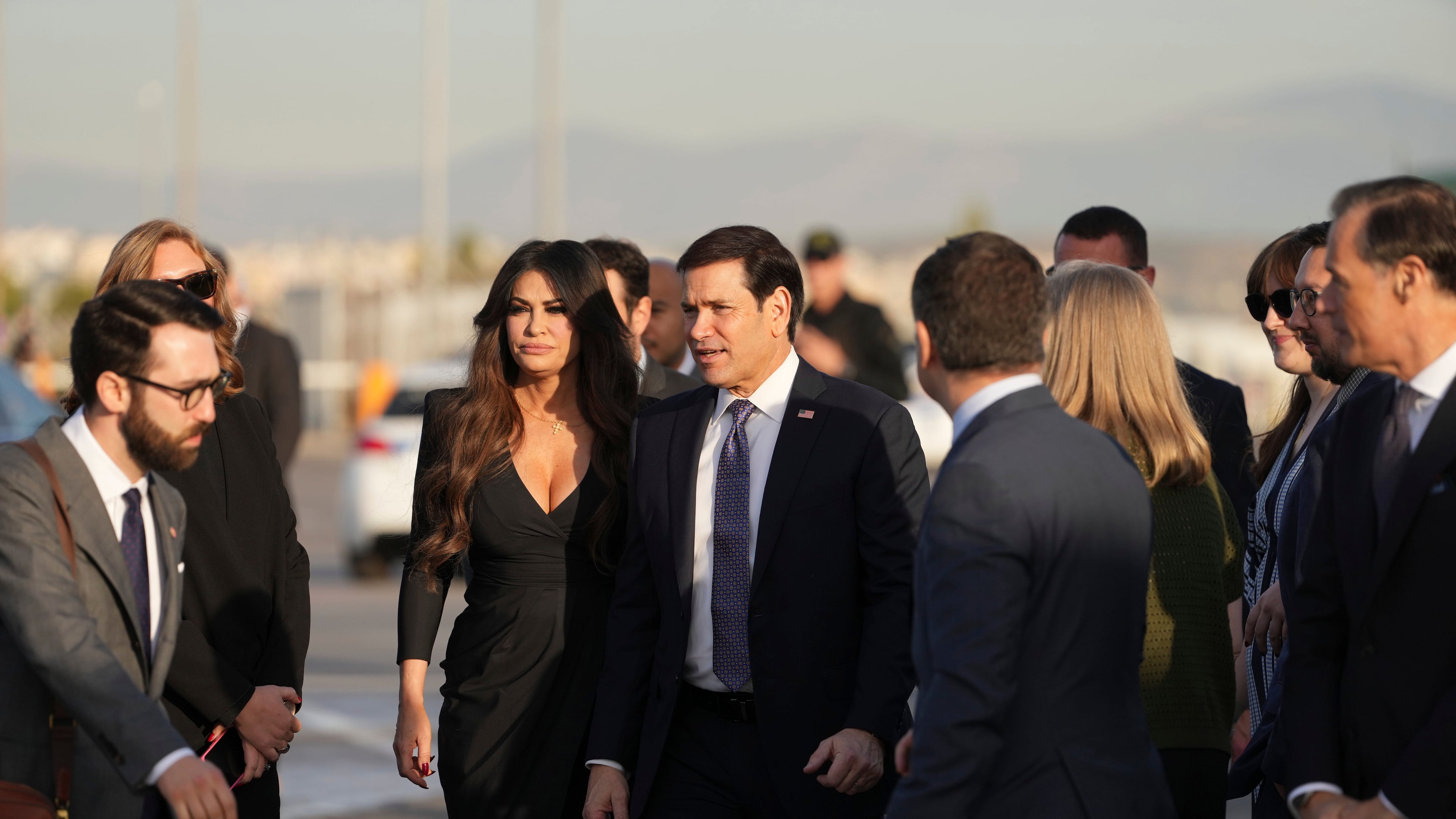 U.S. Secretary of State Marco Rubio, center, and U.S. Ambassador to Greece Kimberly Guilfoyle stand at Eleftherios Venizelos International Airport near Athens, Greece, before Rubio boards a plane , Thursday, Oct. 8, 2026. (AP Photo/Mark Schiefelbein, Pool)