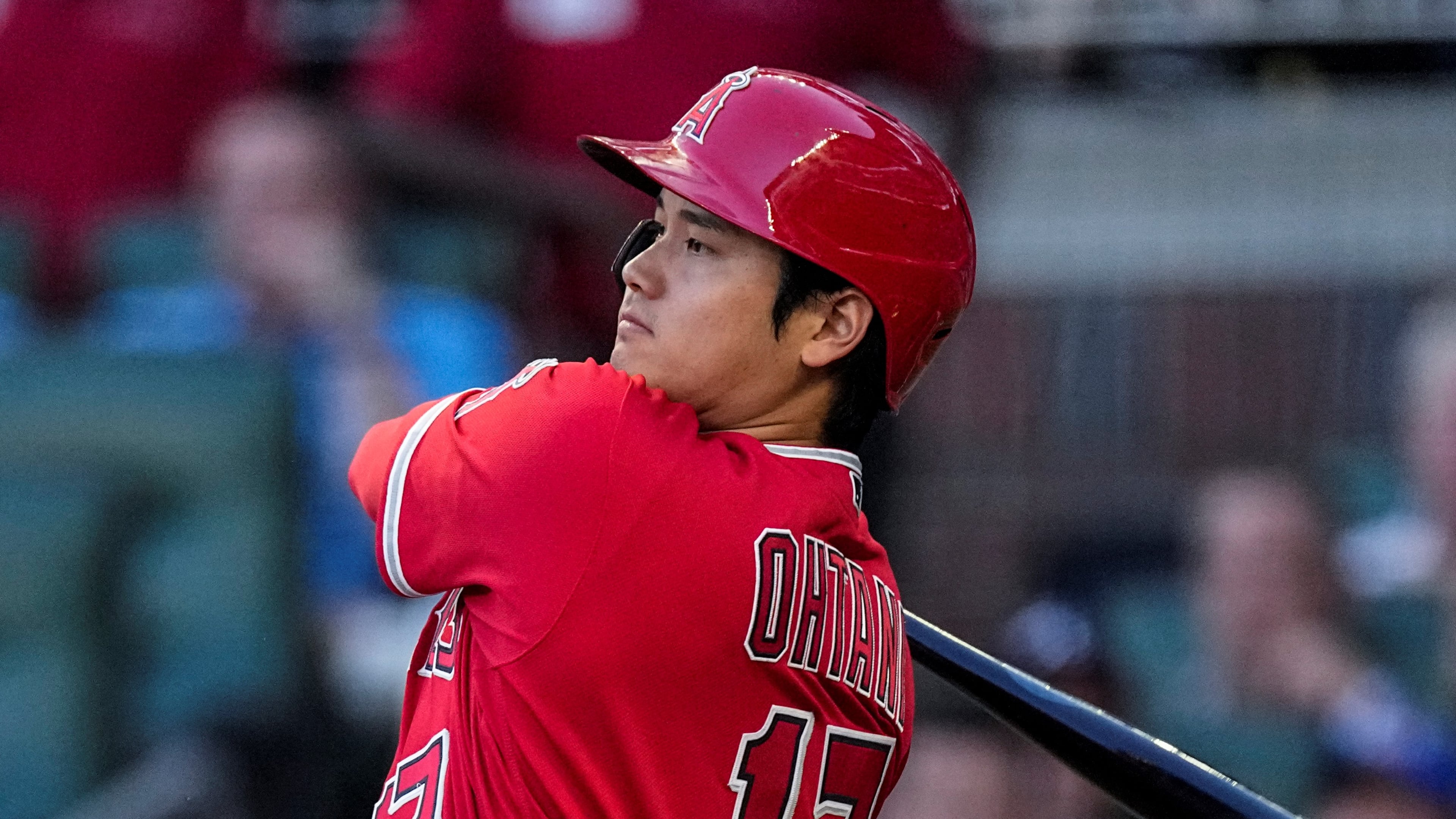 Los Angeles Angels' Shohei Ohtani hits a single in the fourth inning of a baseball game against the Atlanta Braves, Monday, July 31, 2023, in Atlanta. (AP Photo/John Bazemore)