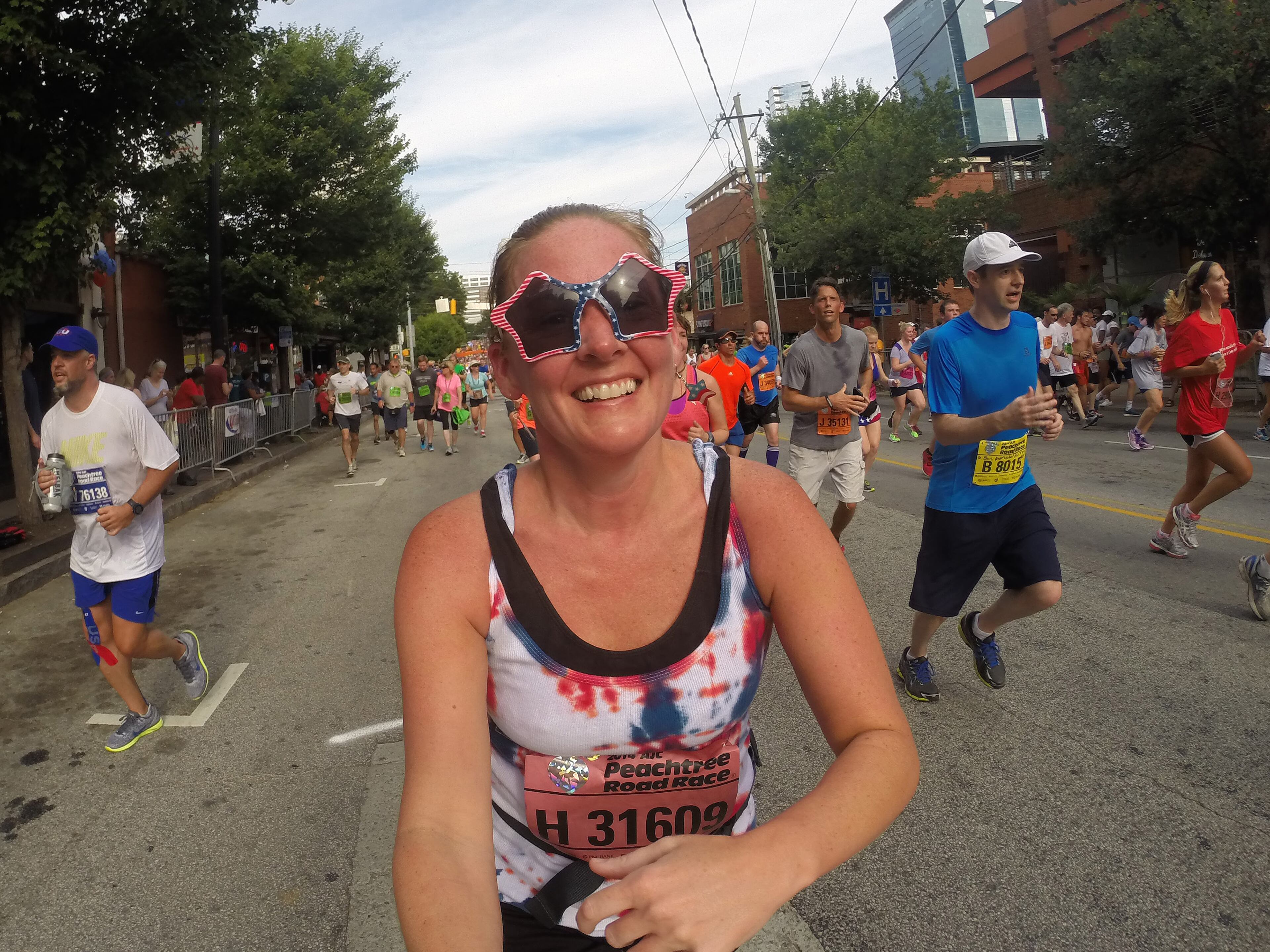 For most people, the AJC Peachtree Road Race is all about getting out and having fun with 60,000 other revelers. With that in mind, AJC Photojournalist Ben Gray passed a camera to runners as he made his way South on Friday morning July 4, 2014 and shot "selfies" of the runners as they carried the camera. BEN GRAY / BGRAY@AJC.COM