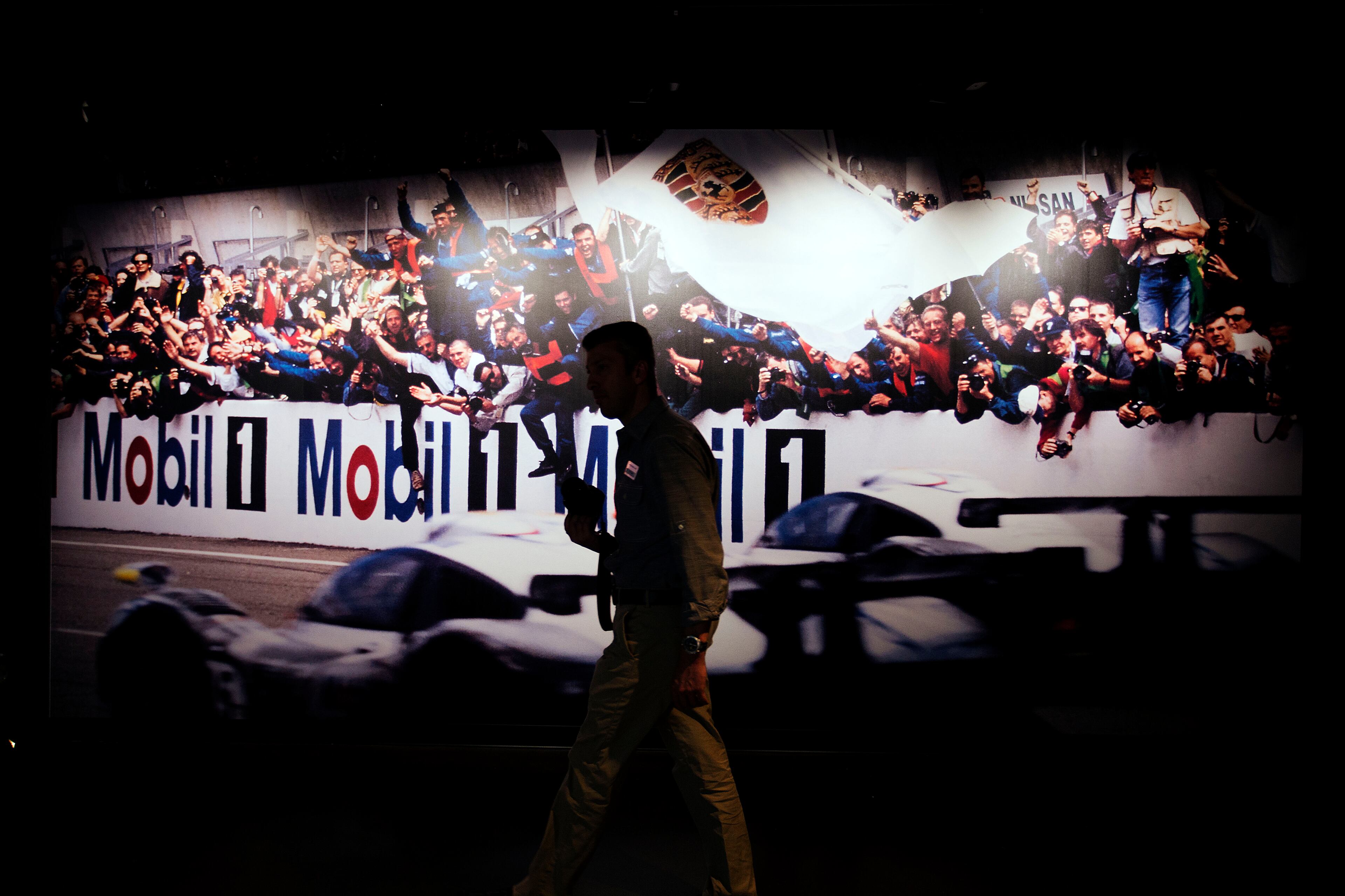 A mural greets visitors to the Porsche Heritage Museum during the opening of the company's new North American headquarters, dubbed the Porsche Experience Center, Thursday, May 7, 2015, in Atlanta. The facility features a human performance fitness center, classic car gallery and restoration center in addition to a driving simulator lab and fine-dining restaurant overlooking a driver development track. (AP Photo/David Goldman)