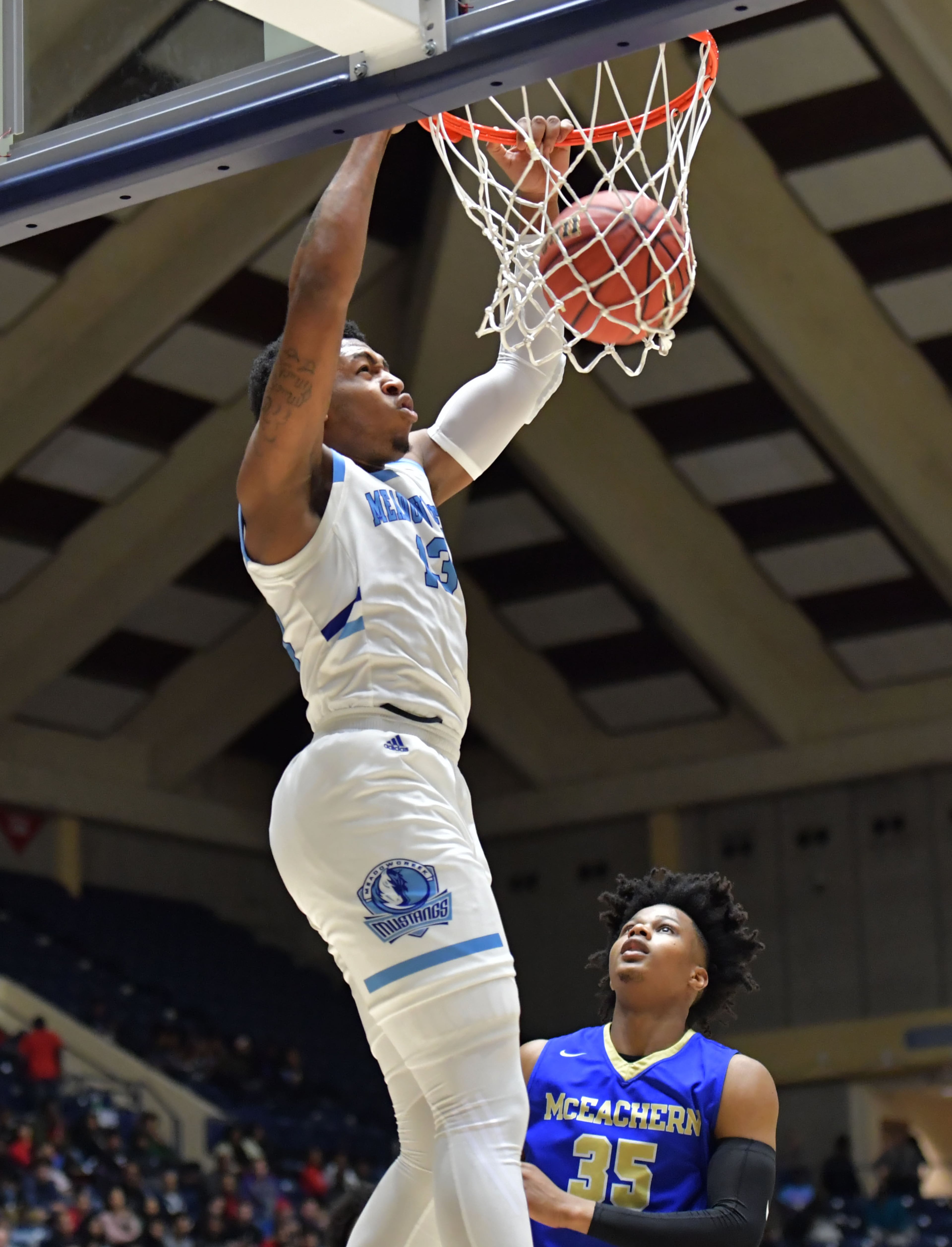 March 9, 2019 Macon - Meadowcreek Jammonie Watkins-Causey (13) dunks the ball against McEachern in GHSA State Basketball Championship game at the Macon Centreplex in Macon on Saturday, March 9, 2019. HYOSUB SHIN / HSHIN@AJC.COM