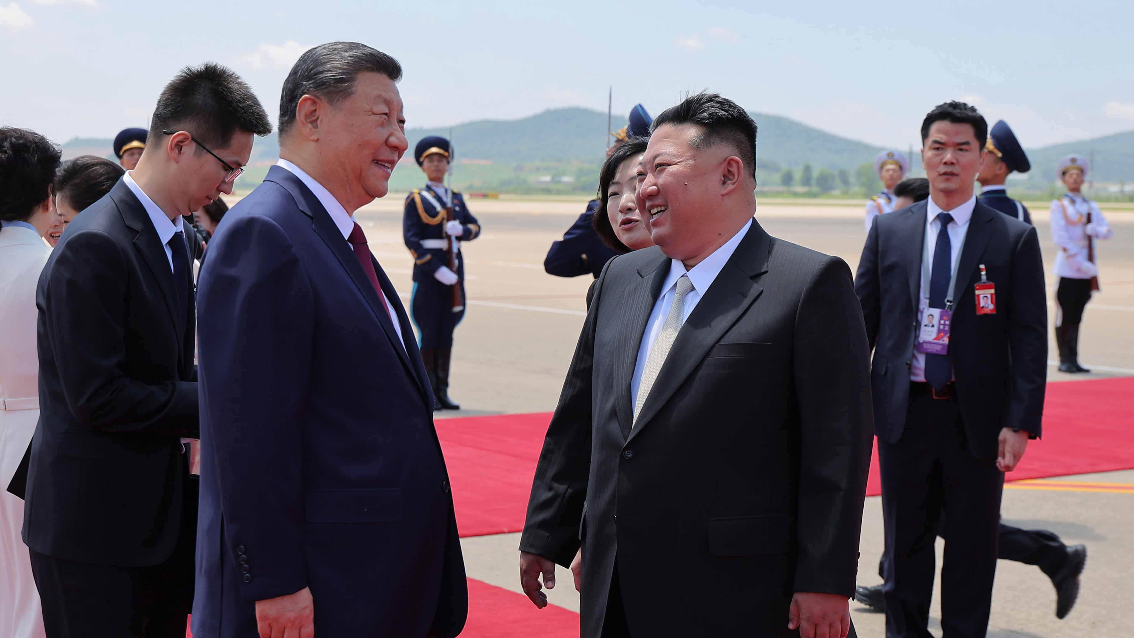 In this photo provided by the North Korean government, North Korean leader Kim Jong Un, front right, greets Chinese President Xi Jinping, center left, on the latter's arrival at the airport in Pyongyang, Monday, June 8, 2026. Independent journalists were not given access to cover the event depicted in this image distributed by the North Korean government. The content of this image is as provided and cannot be independently verified. Korean language watermark on image as provided by source reads: "KCNA" which is the abbreviation for Korean Central News Agency. (Korean Central News Agency/Korea News Service via AP)