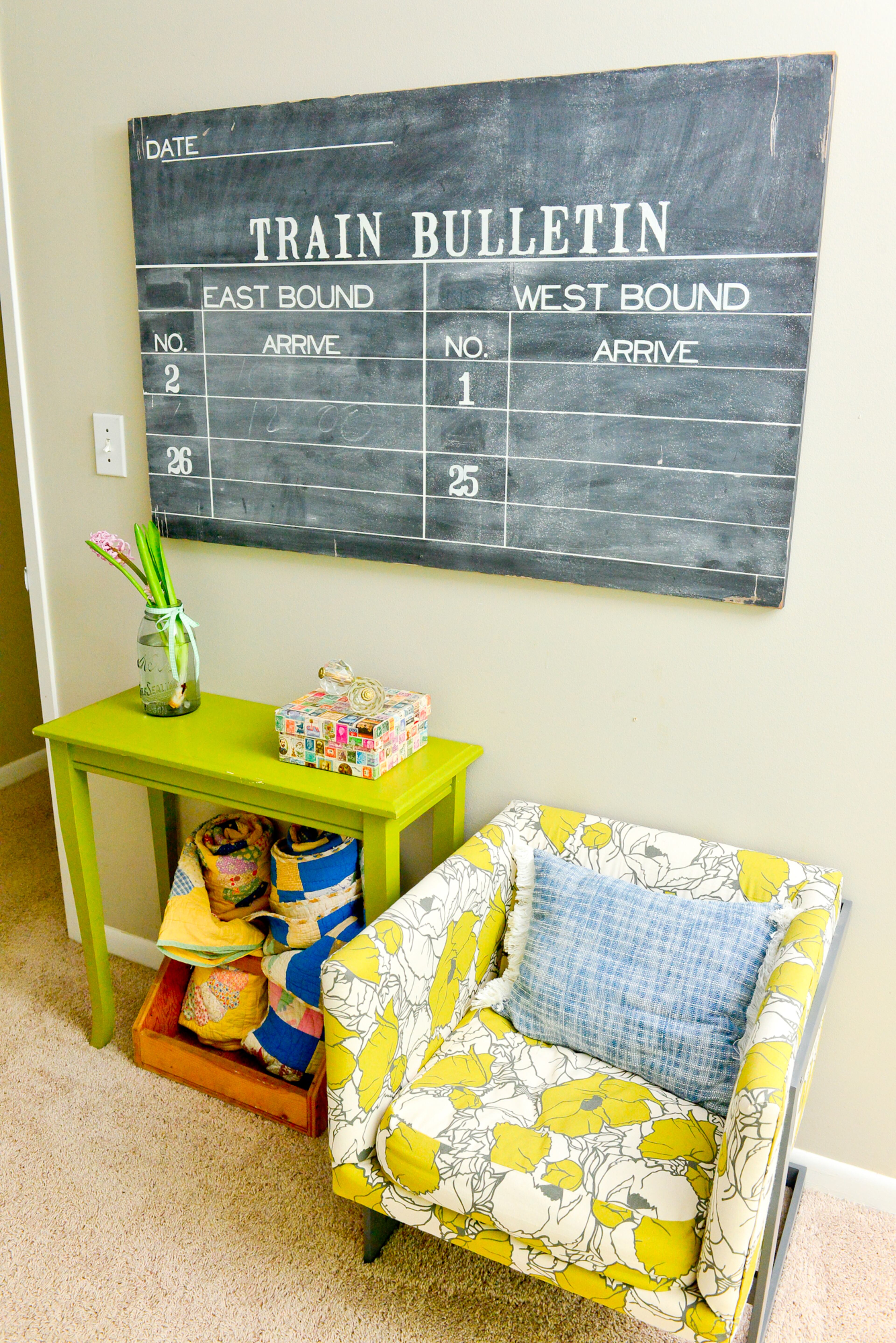 Master bedroom: Chalkboard wall art and a mix of florals and bright colors add a vibrant and vintage pop to a spot in the master bedroom.
