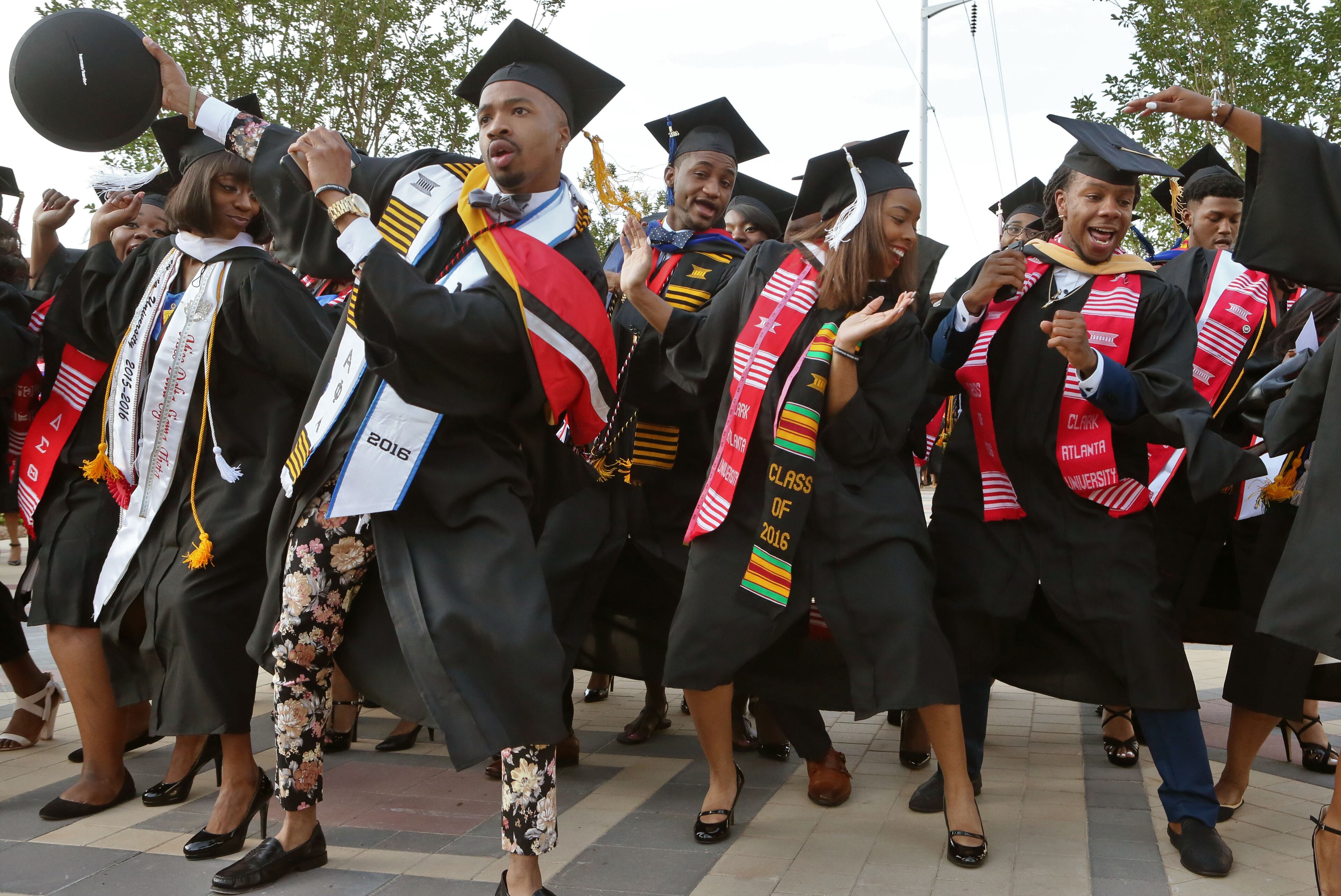 May 16, 2016 - Atlanta - Graduates celebrate as they line up for the processional. Clark Atlanta University class of 2016 filled Panther Stadium Monday morning for it's 27th annual Commencement Service. The keynote speaker was retired astronaut Mae Jemison, the first woman of color in Space. Honorary degrees were awarded to Hamilton Bohannon, a 1964 graduate of Clark College; Roland Carter; Congressman John Conyers, and Congressman Hank Johnson, a 1976 Clark College graduate. BOB ANDRES / BANDRES@AJC.COM