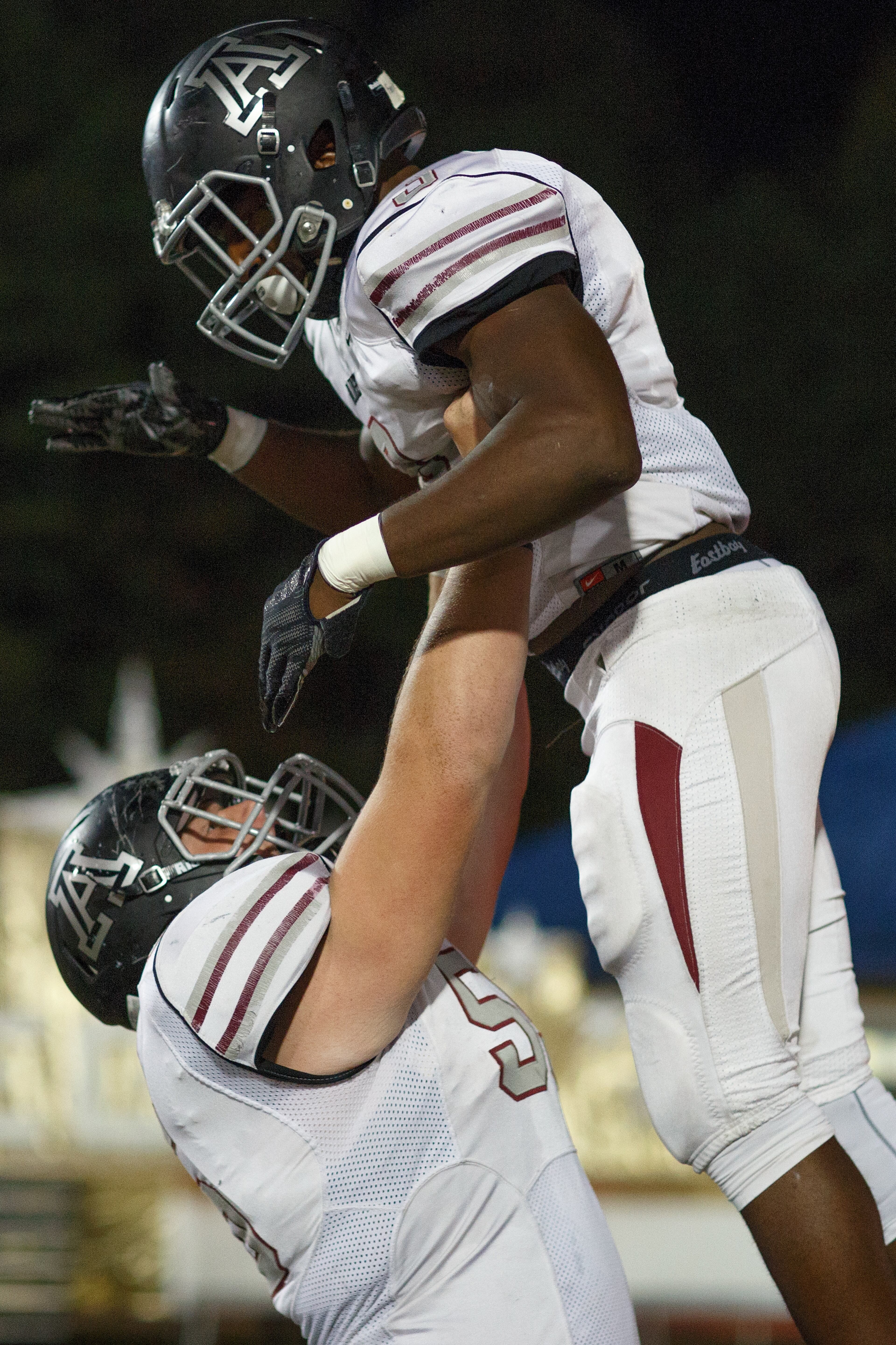 Alpharetta's William Wagner (55) holds Alpharetta's Nolan Edmonds (3) in the air after a touchdown during a GHSA high school football game between Chattahoochee and Alpharetta at Chattahoochee High School on Friday, Nov. 3, 2017, in Johns Creek, Ga. (AJ REYNOLDS/SPECIAL)