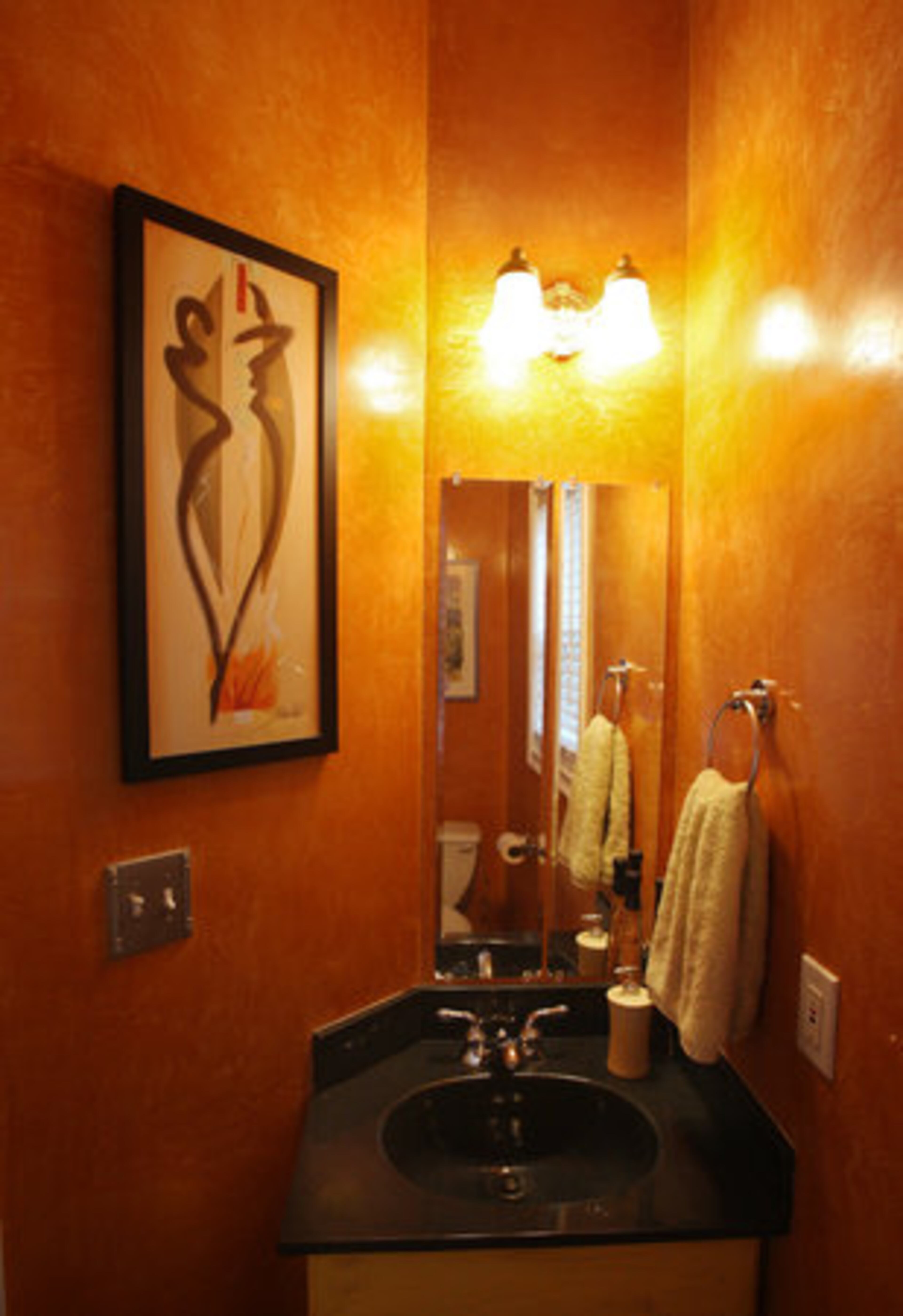The walls in the main floor bathroom have a faux Venetian plaster finish.