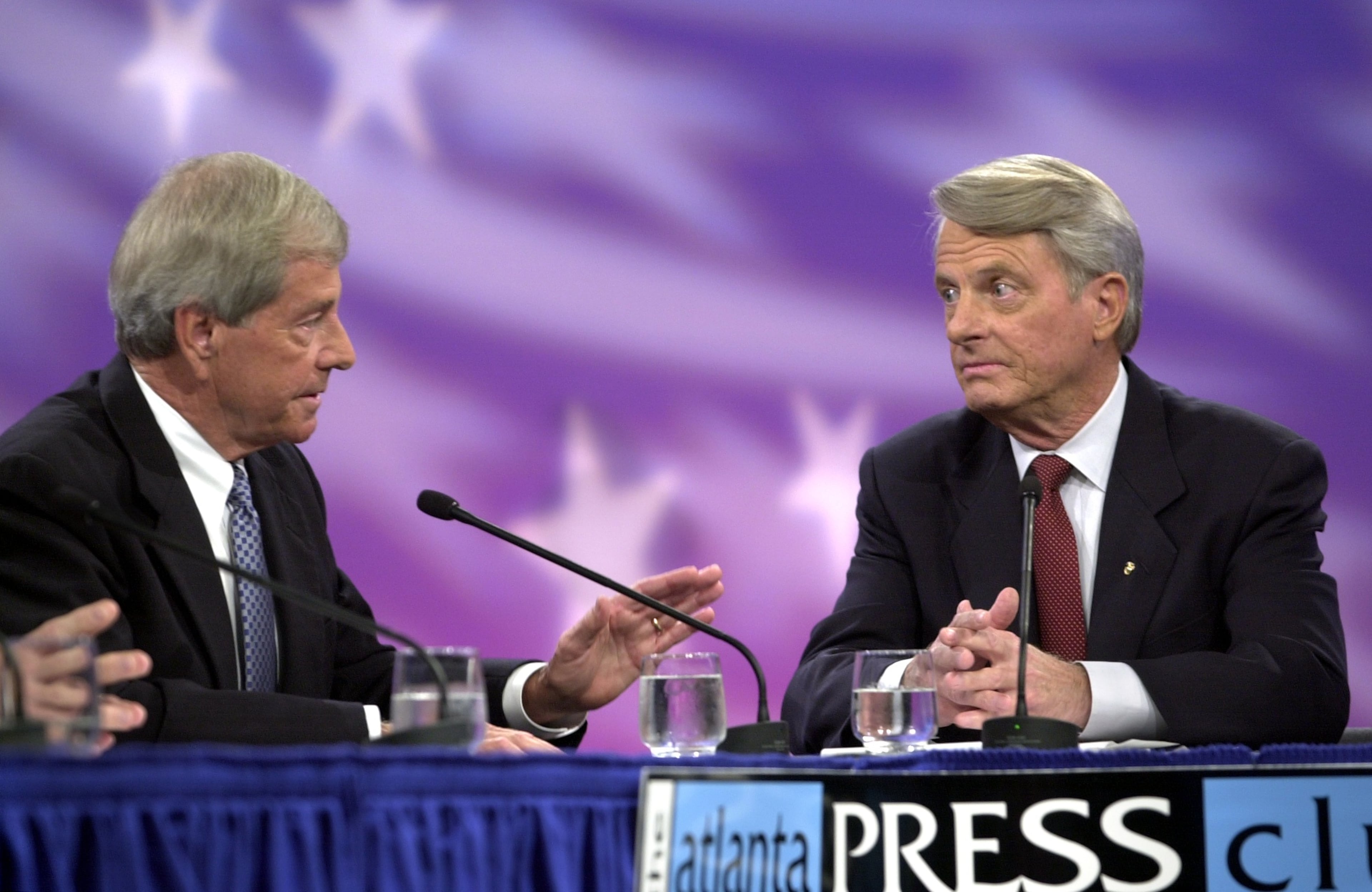 001015 - ATLANTA, GA. - U.S. Senate candidate's debate at GPTV in Atlanta tonight, 10/15/00, sponsored by the Atlanta Press Club. Mack Mattingly (cq-L) is making a point when asked a question by Zell Miller (cq-R). (LOUIE FAVORITE/ STAFF)