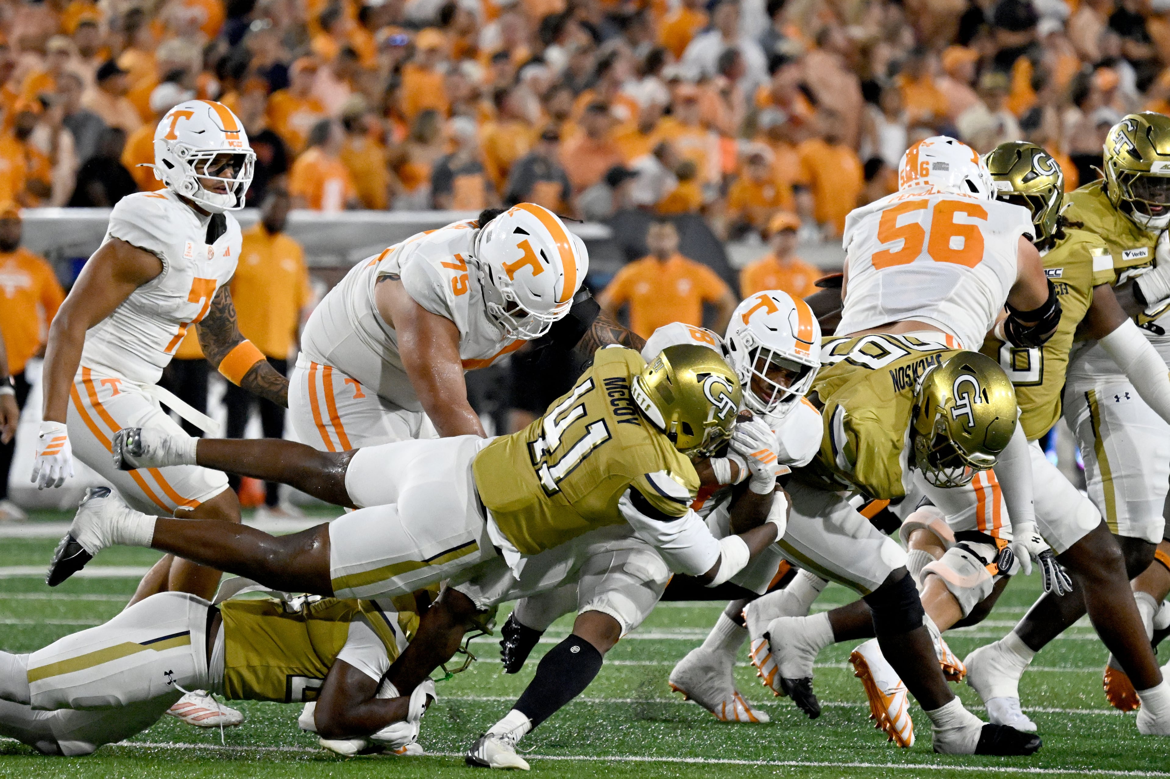 Tennessee running back DeSean Bishop (18) gets tackled by Georgia Tech defensive end Taje McCoy (41) during the second half in an NCAA college football game at Bobby Dodd Stadium on Saturday, Sept. 12, 2026, in Atlanta. Tennessee defeated Georgia Tech 45-24. (Hyosub Shin/AJC)