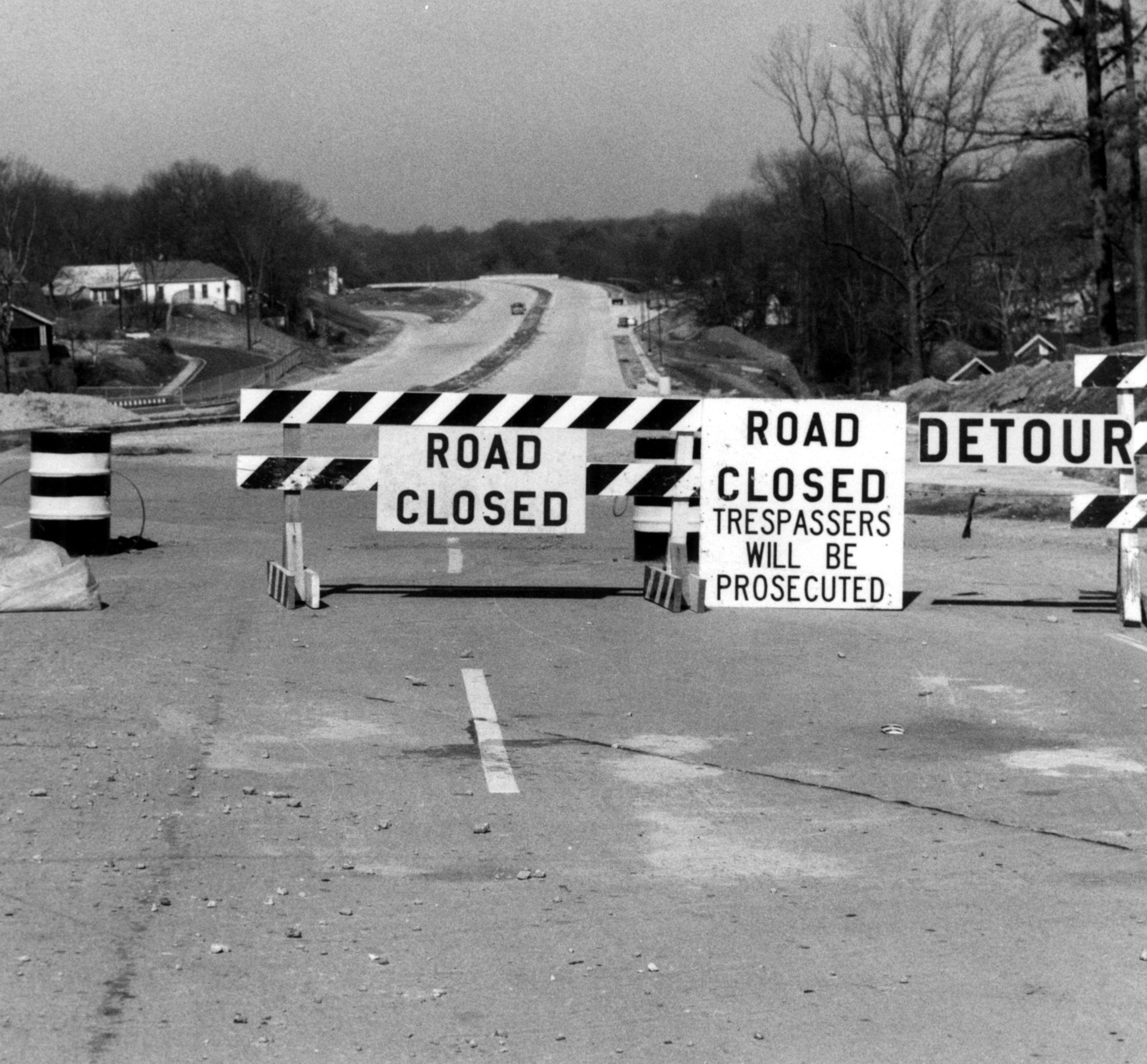 ATLANTA, GA -- Interstate 20, between Ashby and Peters Streets, facing west. Shoulder and median work are cited as the cause for traffic atery being kept closed. Road signs warn trespassers to stay away. (Bob Dendy/AJC staff) 1966
