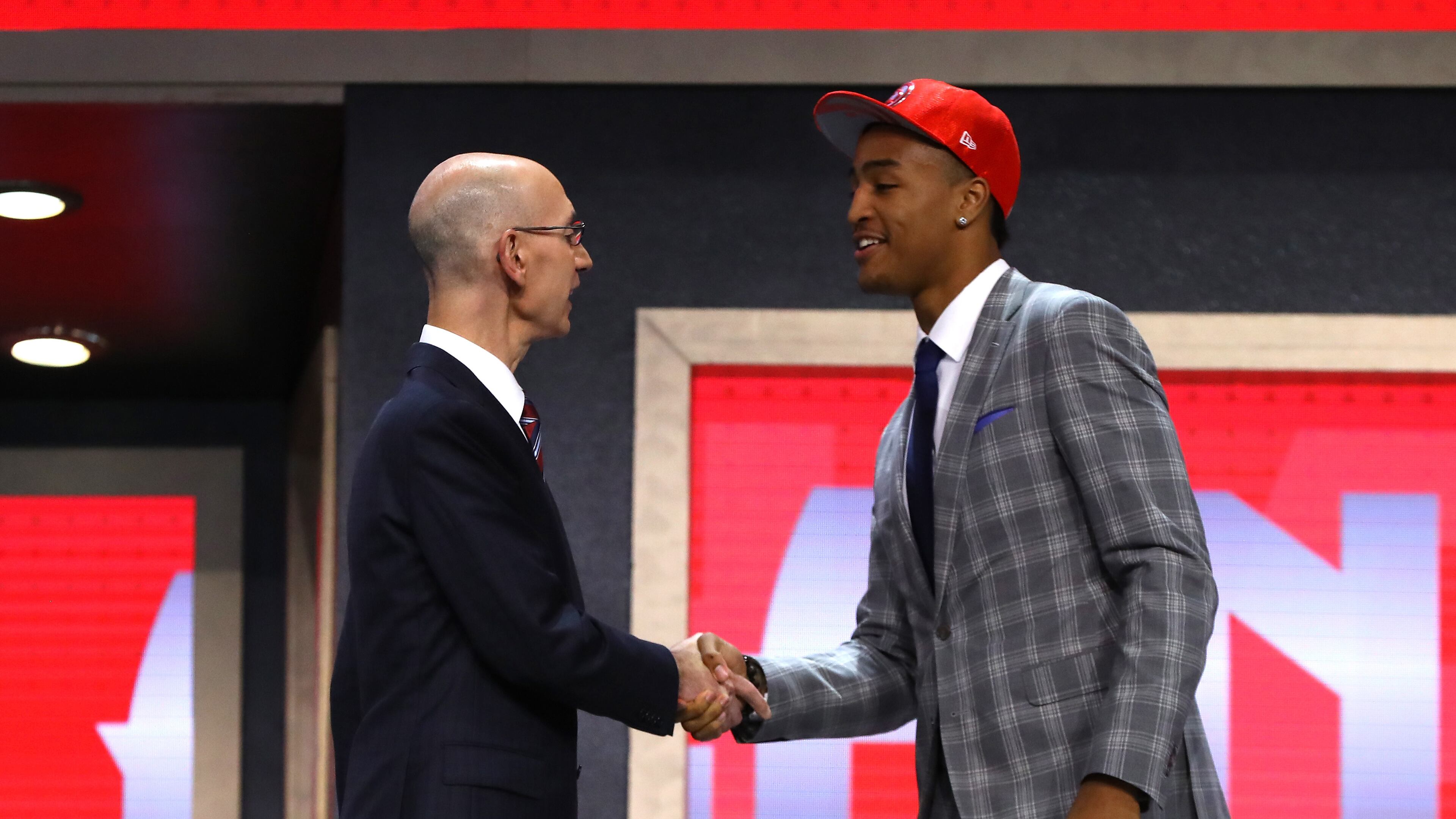 John Collins walks on stage with NBA commissioner Adam Silver after being drafted 19th overall by the Atlanta Hawks during the first round of the 2017 NBA Draft at Barclays Center on June 22, 2017 in New York City. (Photo by Mike Stobe/Getty Images)