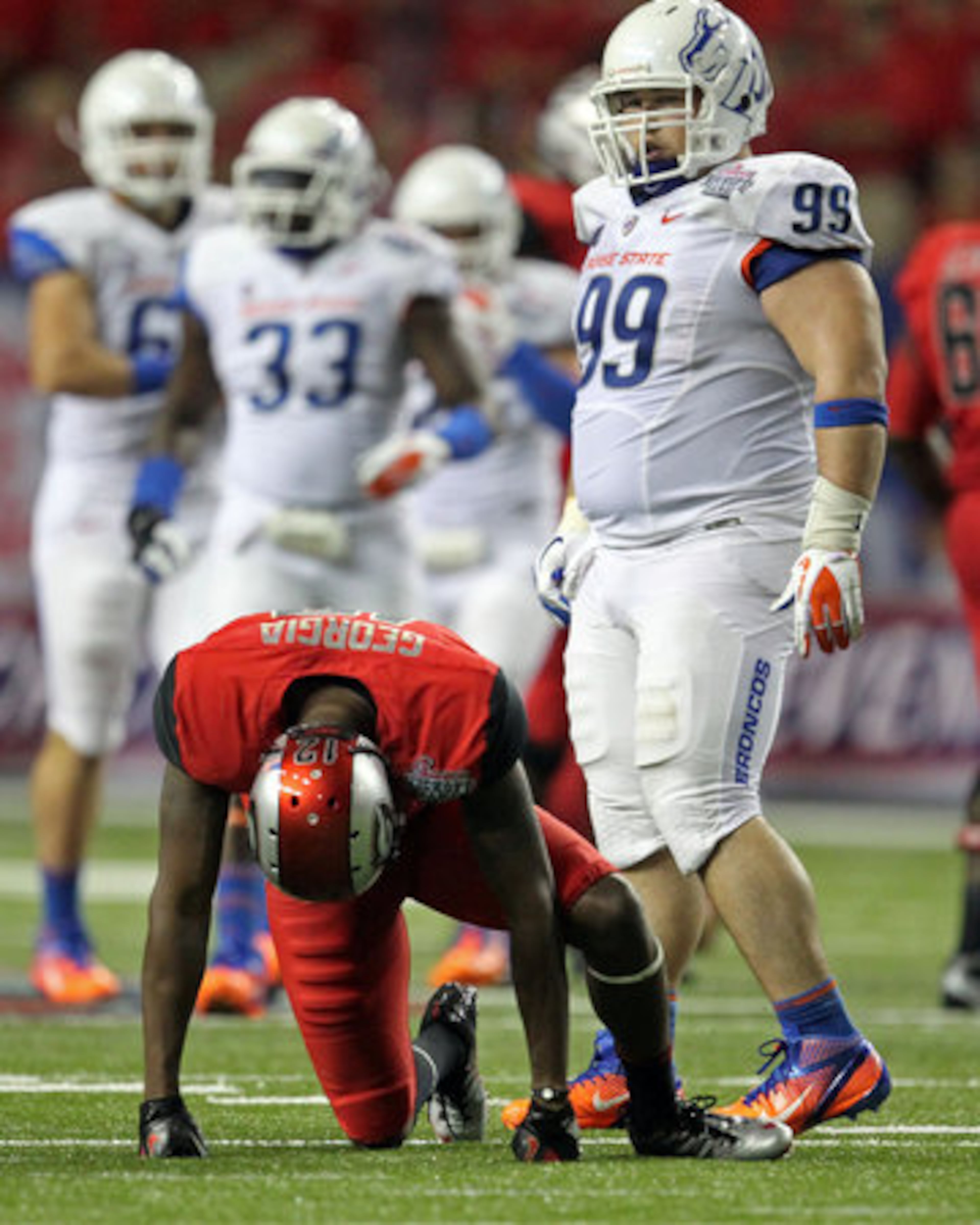 Georgia receiver Tavarres King (12) is slow to get up after failing to make a catch on a fourth down play late in the game. The Bulldogs couldn't make plays when they needed to all night and lost to Boise State 35-21 to open the season in the Georgia Dome.