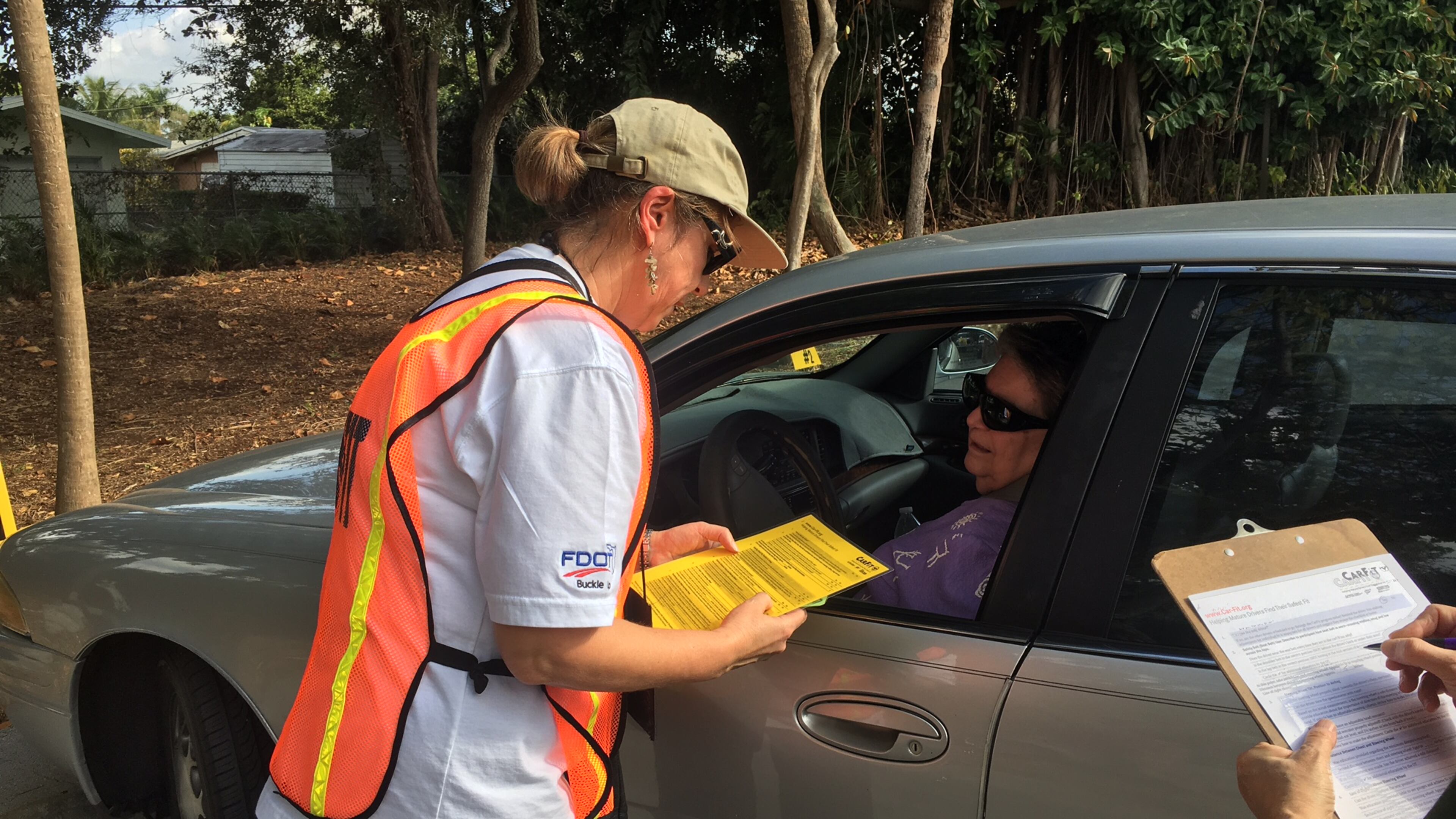 CarFit volunteer Lucy Mead of North Palm Beach, Florida, speaks with Shirley Hennessey during a session to make recommendations on how Hennessey can make her car more safe and comfortable at the Mae Volen Senior Center in Boca on Dec. 6, 2016.