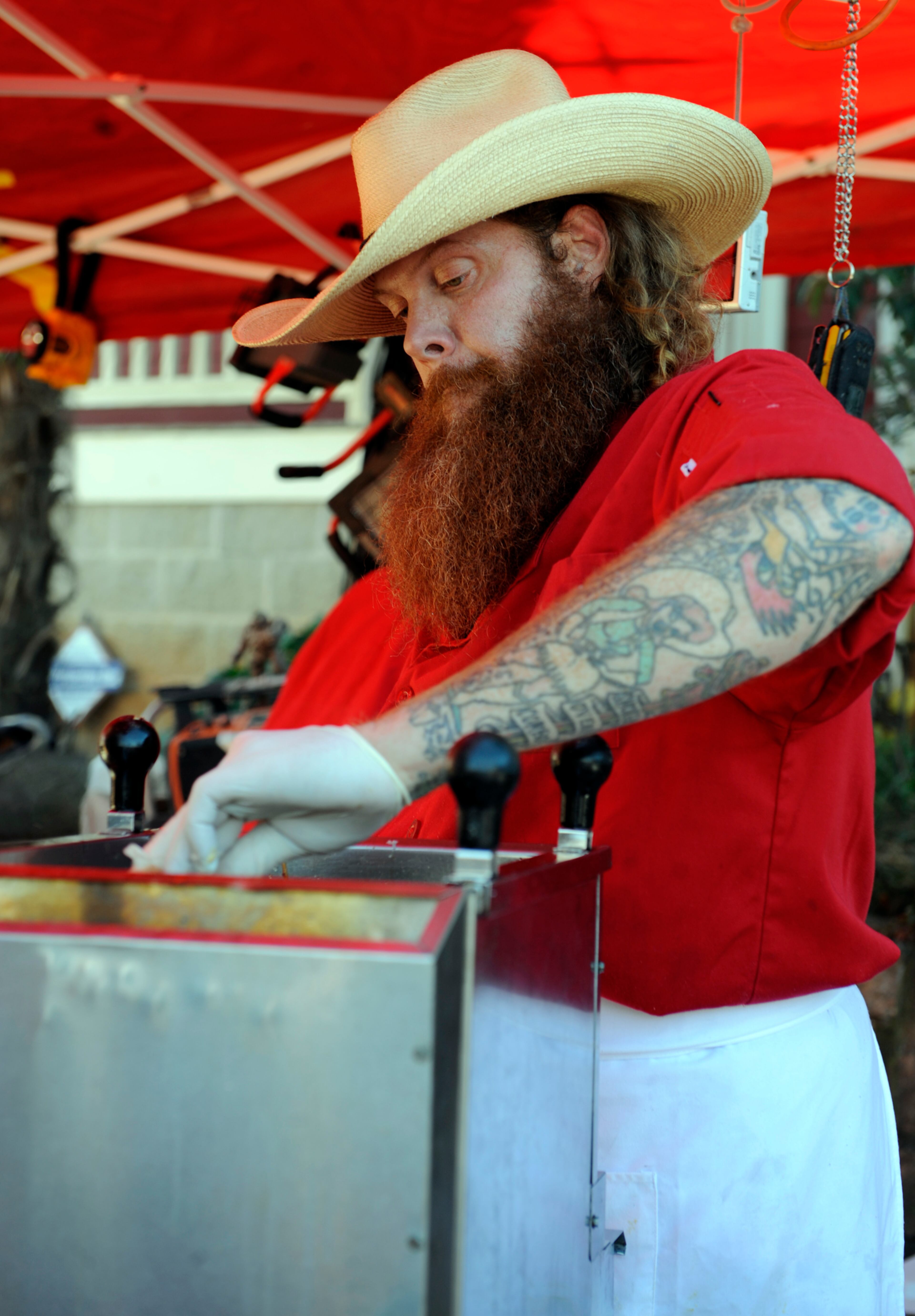 Jim Stacy dips freshly battered hotdogs into a deep fryer at Chomp 'n Stomp in Cabbagetown Saturday, Nov 7, 2009. In the past, Stacy has fronted an all-clown rock band, owned the Star Bar, and worked as a tattoo artist. He currently manages the Starlight Drive-in. In his new PBA series, "Get Delicious, " he takes a look at some iconic Atlanta restaurants like the Colonnade, the Silver Skillet, Nick's Food to Go. Elissa Eubanks, eeubanks@ajc.com