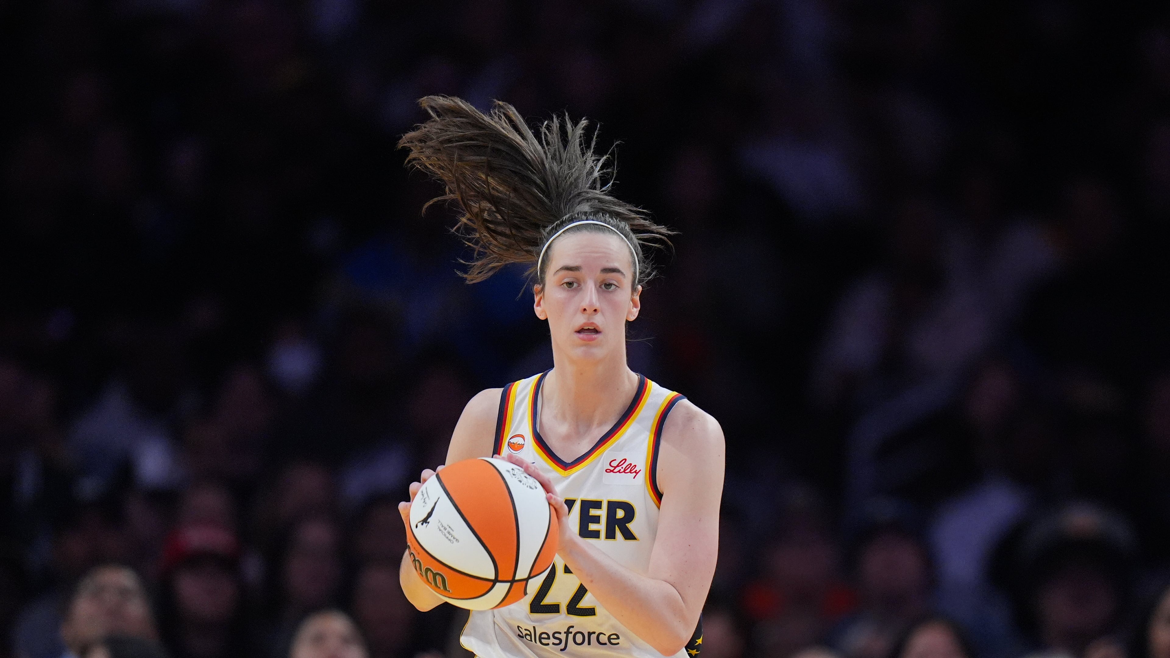 Indiana Fever guard Caitlin Clark (22) dribbles during the first half of a WNBA basketball game against the Los Angeles Sparks Wednesday, May 13, 2026, in Los Angeles. (AP Photo/Jae C. Hong)