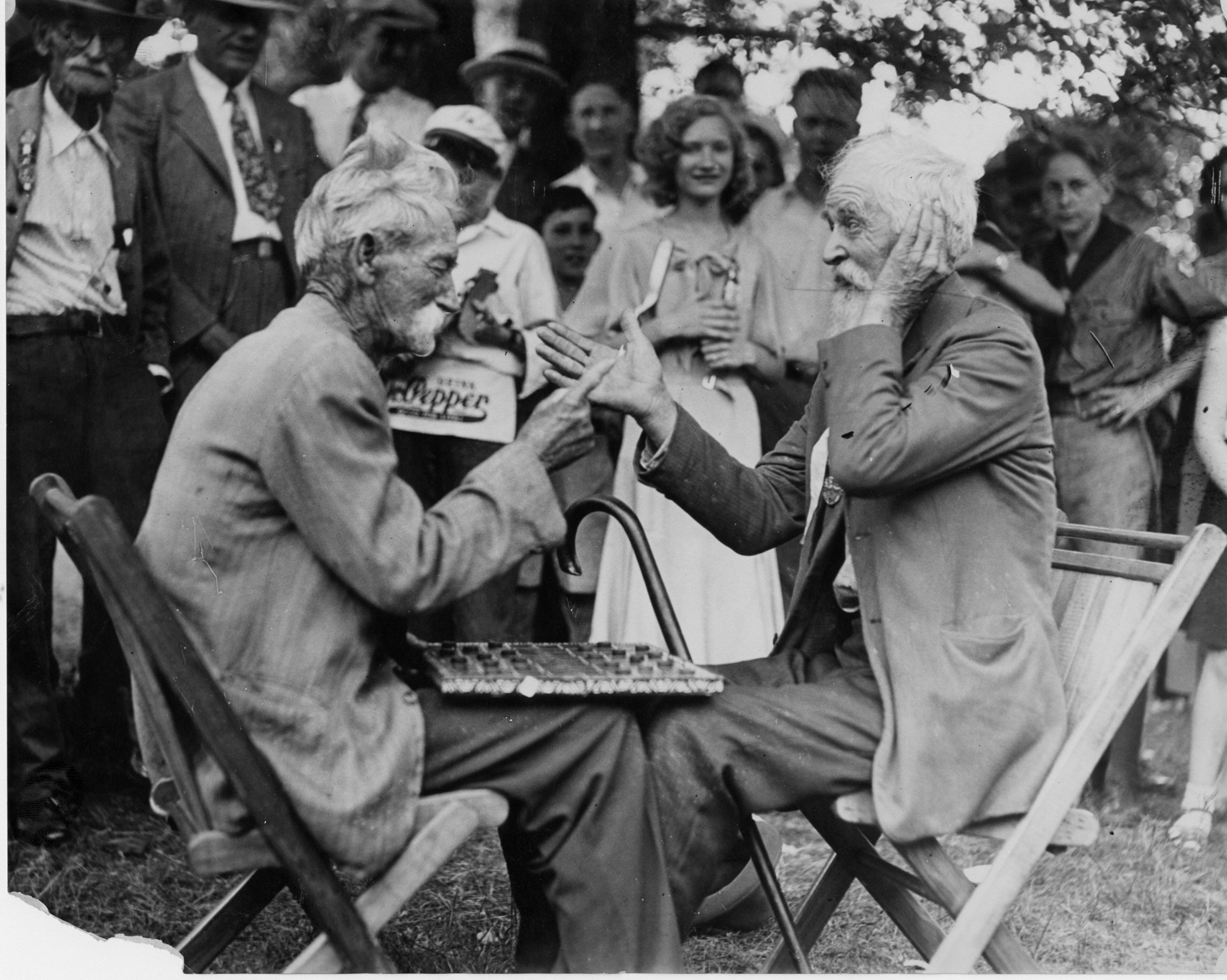 Original caption: "June, 1931 -- Montgomery, Ala: At the 41st Annual Reunion of the United Confederate Veterans, held at Montgomery, Ala., June 2-5 - T. O. Day and T. A. Prince, two hardy Texans, were playing a friendly game of checkers when someone mentioned General Lee, and they both exclaimed, 'Now, back in sixty-one...'"