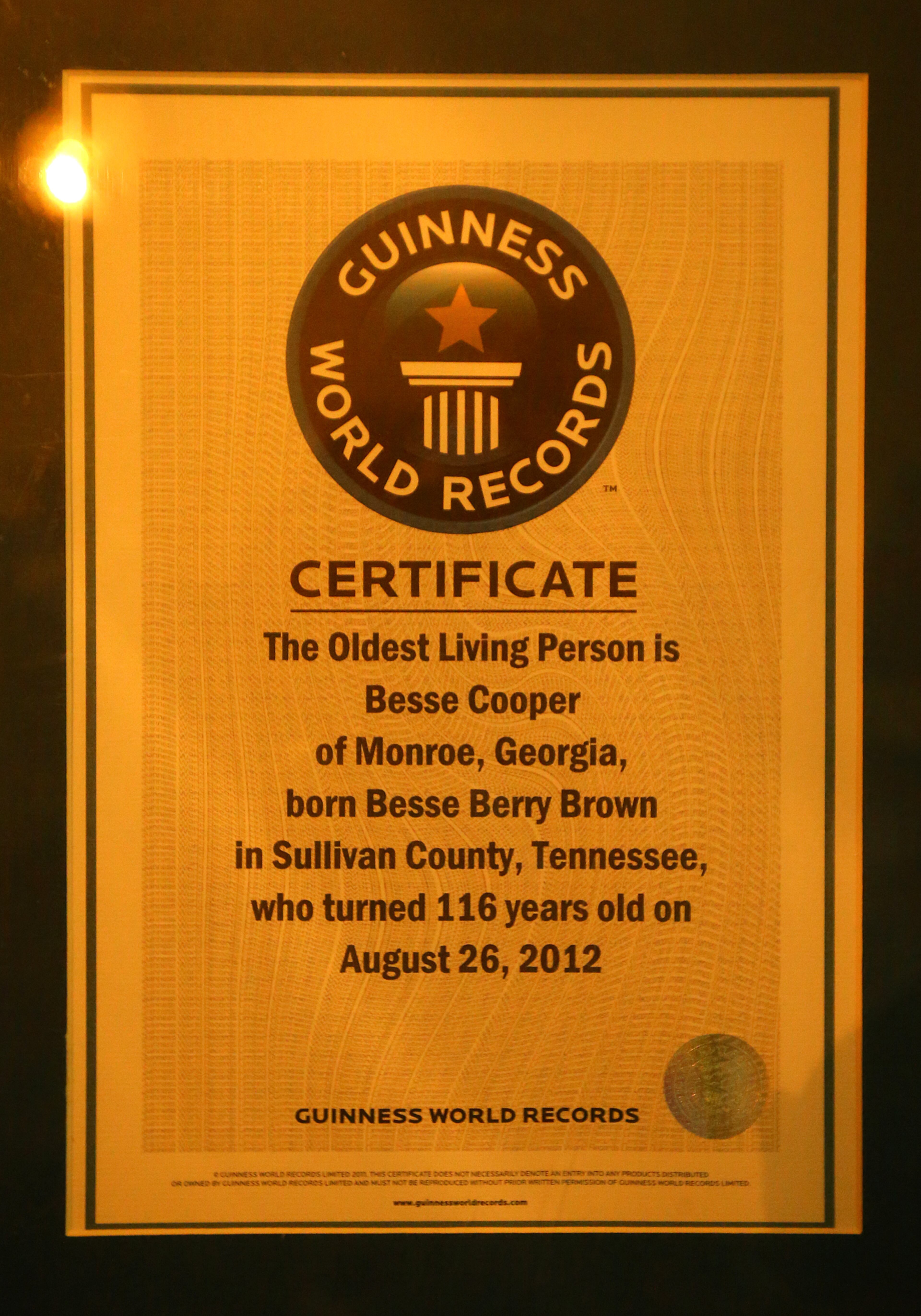 A Guinness World Records certificate hangs on the wall inside the home of Miss Besse Cooper on Monday, May 19, 2014, in Monroe. Cooper was the oldest person in the world until she died at the age of 116 years and 100 days in 2012. CURTIS COMPTON / CCOMPTON@AJC.COM
