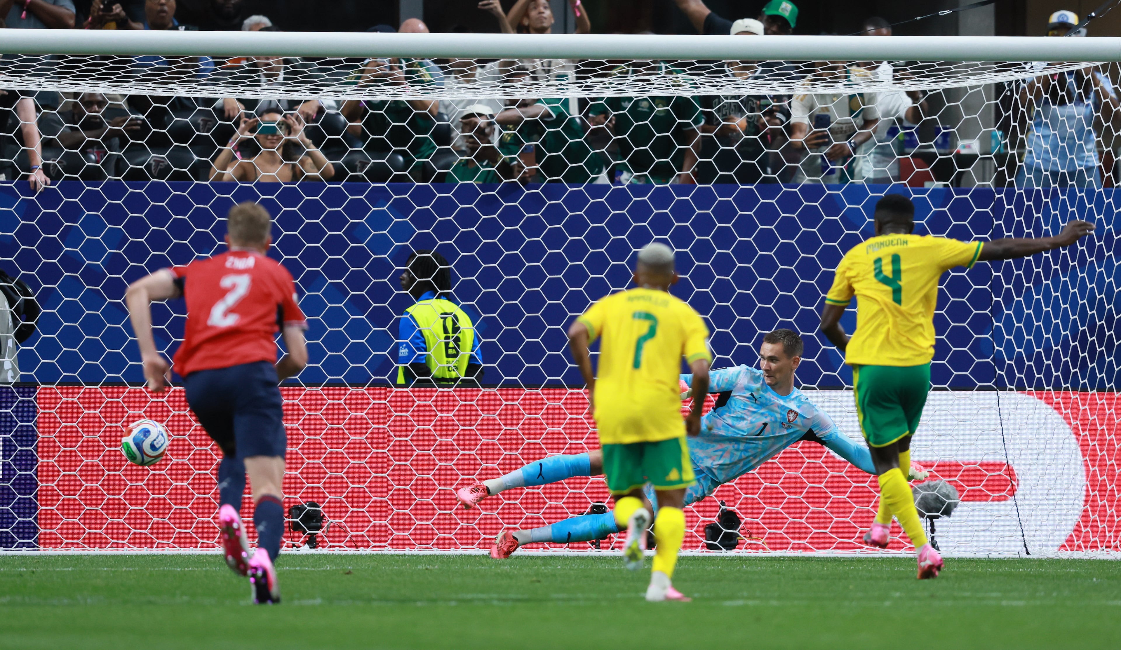 South Africa's Teboho Mokoena (right) successfully converts on a penalty kick past Czech Republic goalkeeper Matej Kovar (center right) during second half of their World Cup match at Atlanta Stadium on Thursday, June 18, 2026. (Jason Getz/AJC)