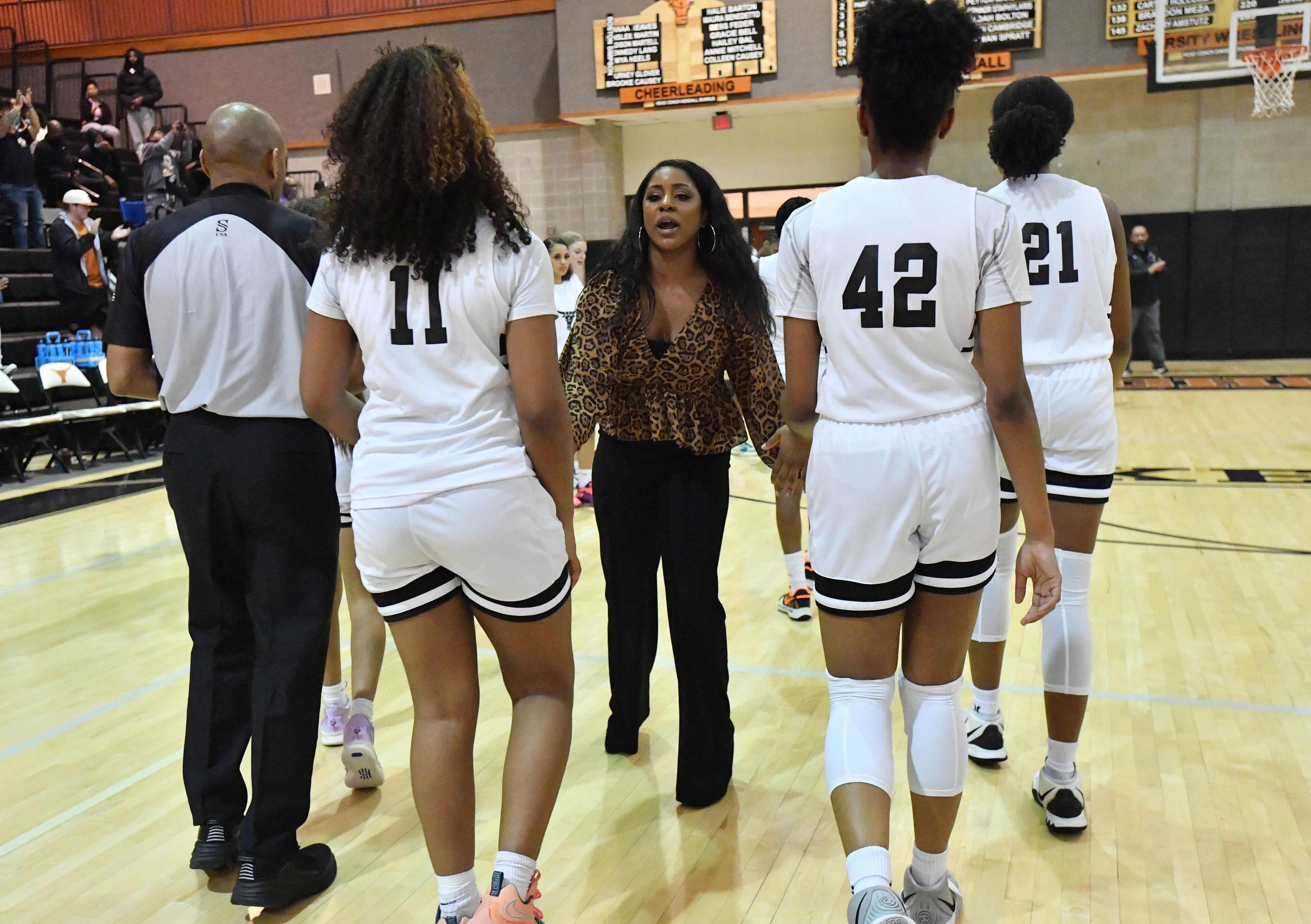 February 25, 2022 Marietta - Kell’s head coach Kandra Bailey congratulates players after defeating Langston Hughes during 2022 Georgia Girls State Basketball playoffs at Kell high school in Marietta on Friday, February 25, 2022. Kell won 57-50 over Langston Hughes. (Hyosub Shin / Hyosub.Shin@ajc.com)