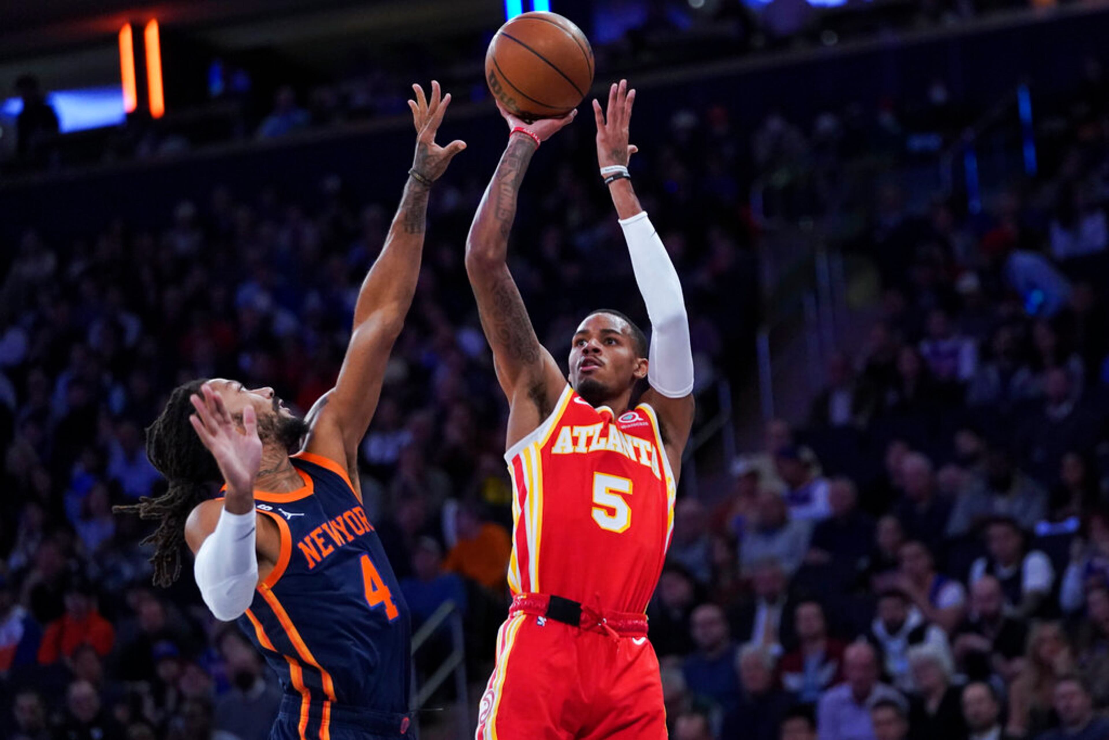 Atlanta Hawks guard Dejounte Murray (5) shoots as New York Knicks guard Derrick Rose (4) defends during the first half of an NBA basketball game Wednesday, Nov. 2, 2022, at Madison Square Garden in New York. (AP Photo/Mary Altaffer)