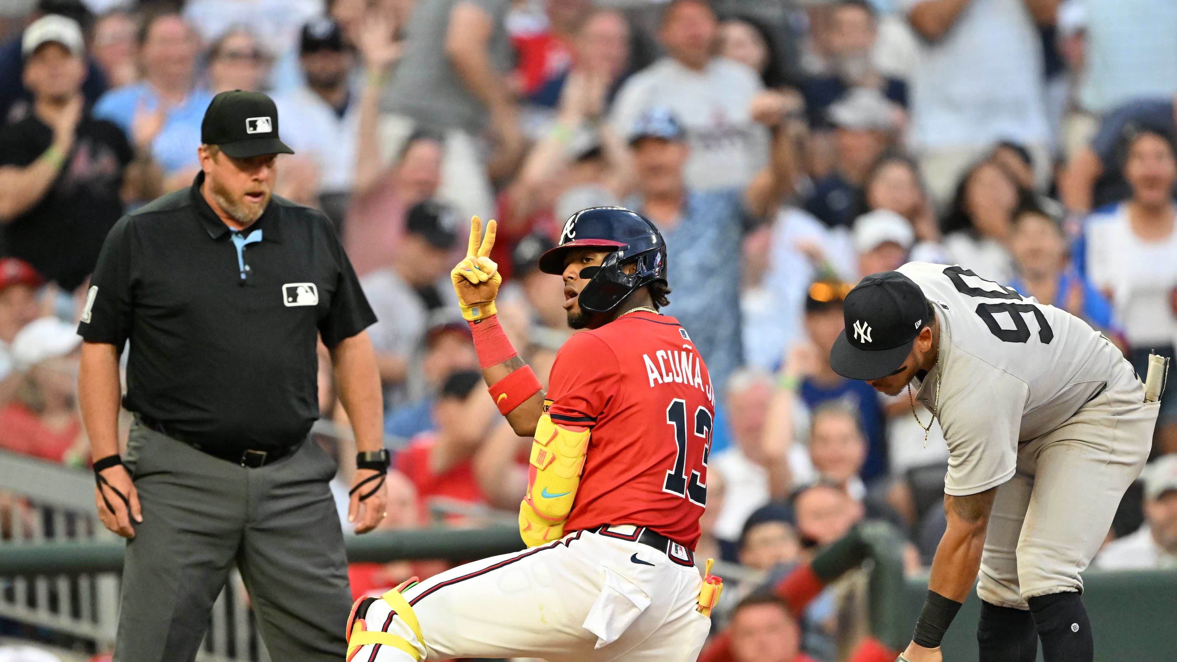 Atlanta Braves outfielder Ronald Acuña Jr. (13) celebrates at third base after hitting a triple during the fourth inning of a baseball game at Truist Park, Friday, July 18, 2025, in Atlanta. Atlanta Braves won 7-3 over New York Yankees. (Hyosub Shin / AJC)