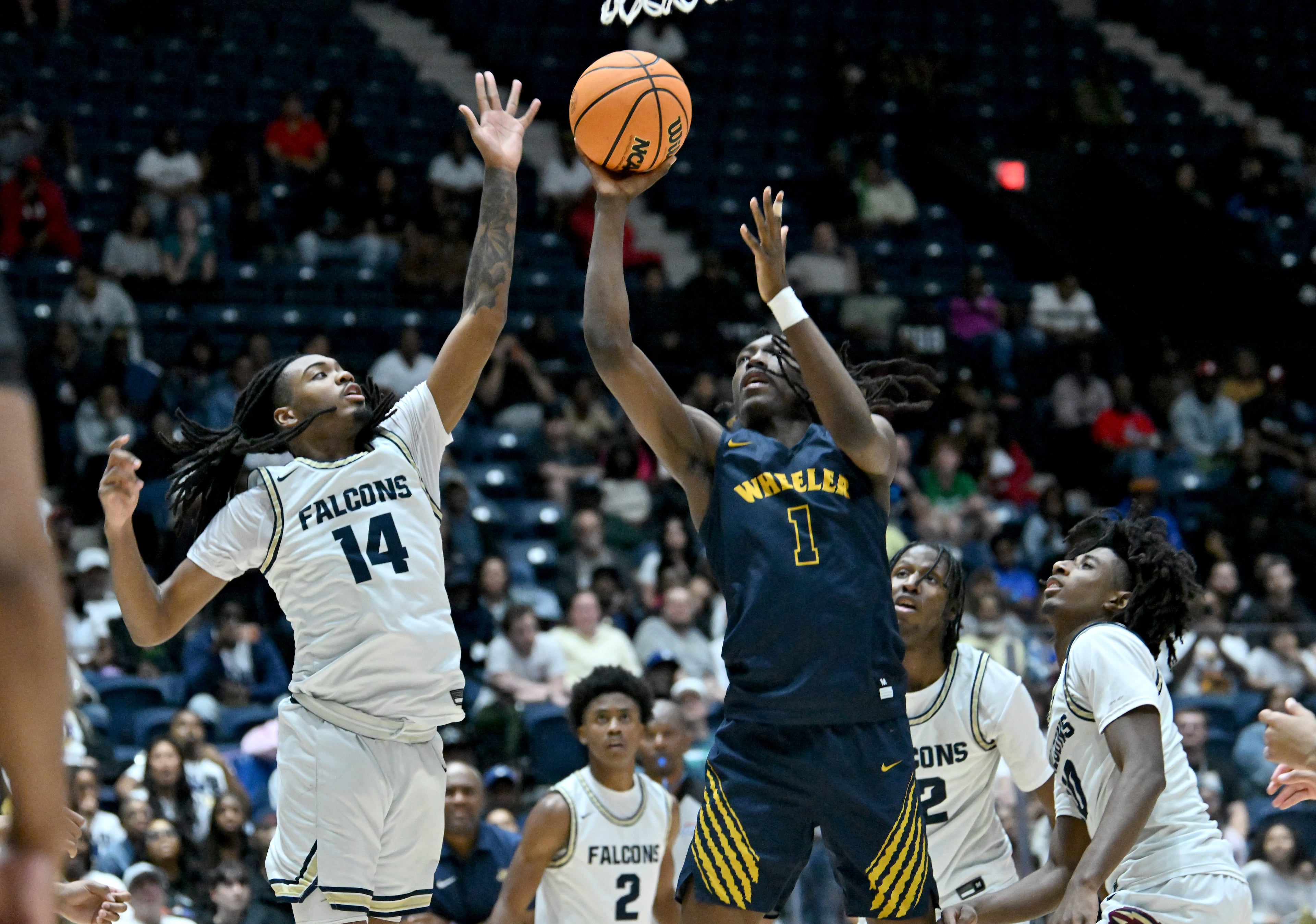 Wheeler Jaron Saulsberry (1) shoots against Pebblebrook Jaylen Humphrey (14) during the second half in Class 6A Boys GHSA State Championship at the Macon Coliseum, Saturday, March 14, 2026, in Macon. Wheeler won 62-52 over Pebblebrook. (Hyosub Shin/AJC)
