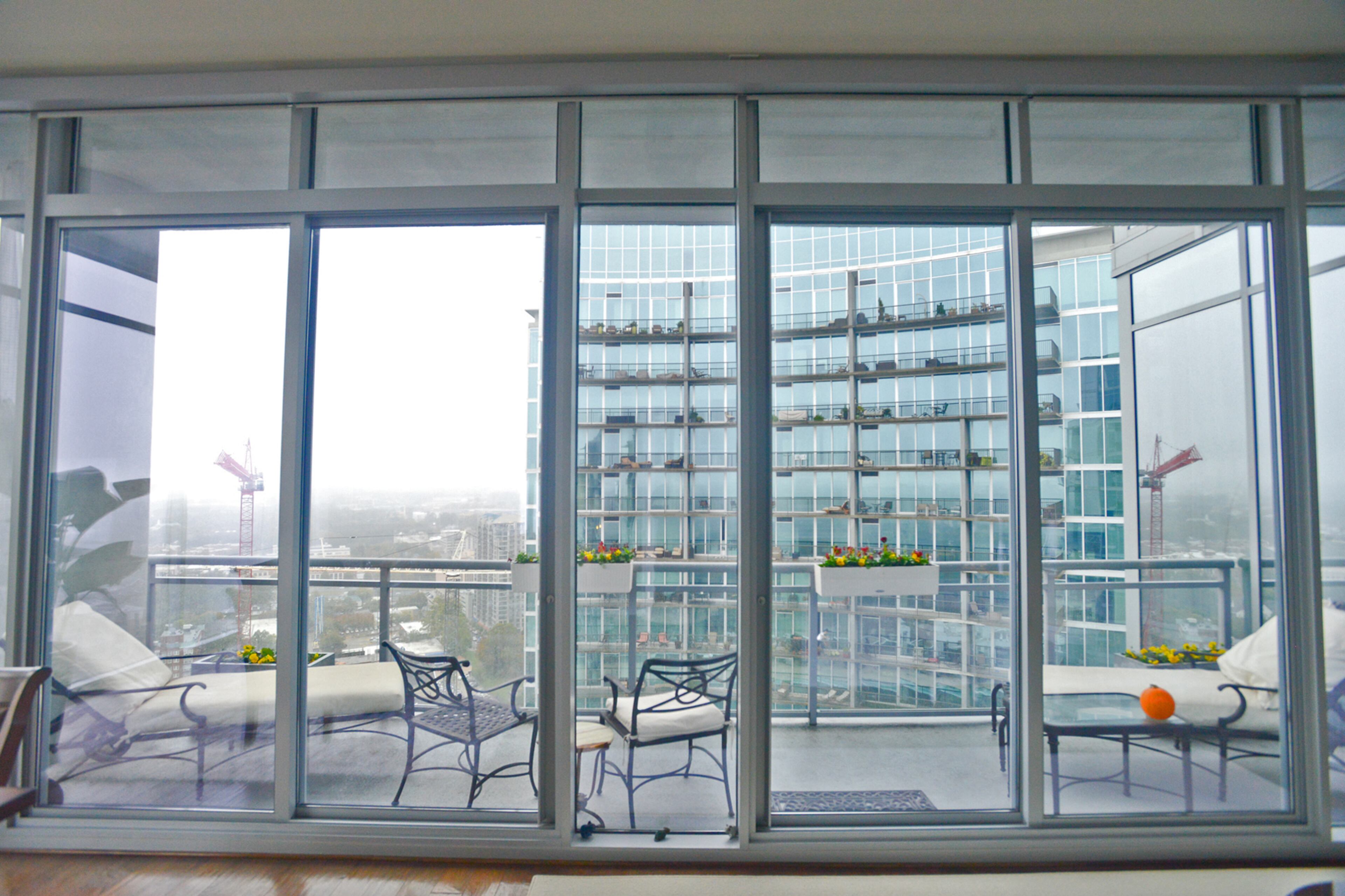 A wall of windows in the dining room of Jim Wilson's high-rise condo opens to a large balcony overlooking Midtown Atlanta. He can see Buckhead, downtown Atlanta and Piedmont Park. "The night lights are unbelievable," he said.