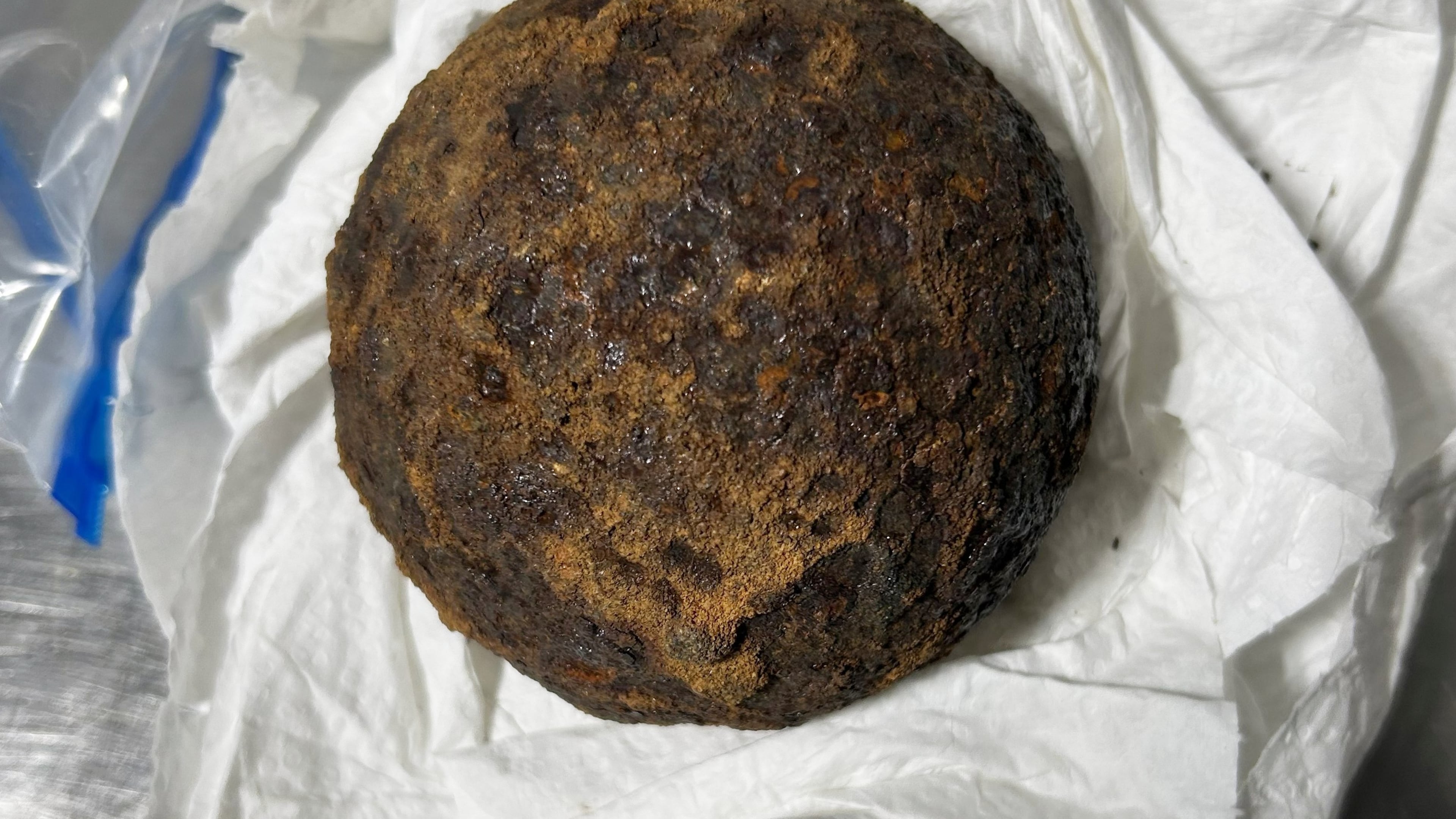 This photo provided by the Transportation Security Administration (TSA) shows a stolen Civil War-era cannonball discovered by TSA officers in a checked bag at the Gulf Shores International Airport in Gulf Shores, Ala., on July 18, 2026. (Transportation Security Administration via AP)