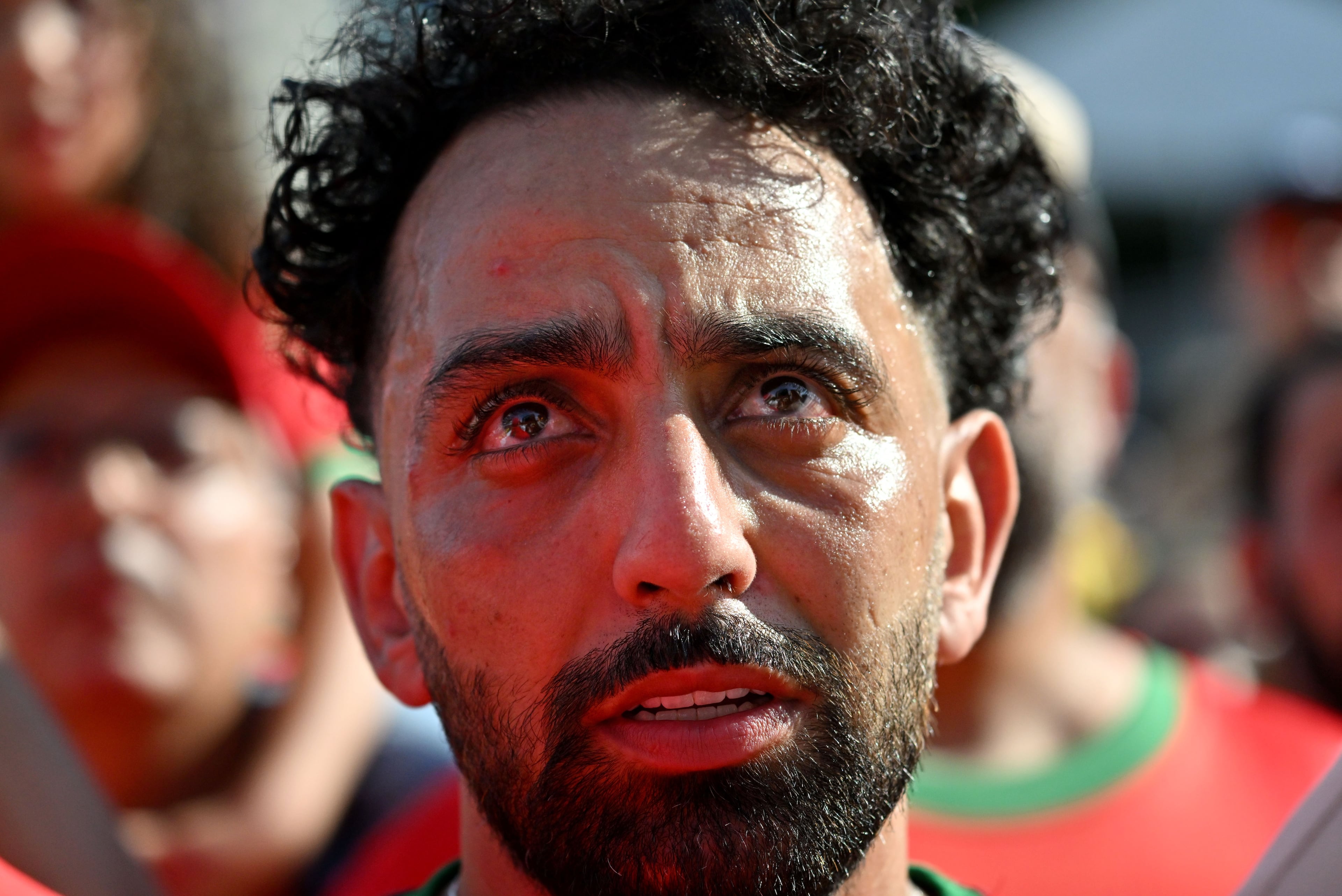 A Morocco fan watches intently the match against Brazil on a screen during a watch party at the FIFA Fan Festival in Atlanta. (Hyosub Shin/AJC)