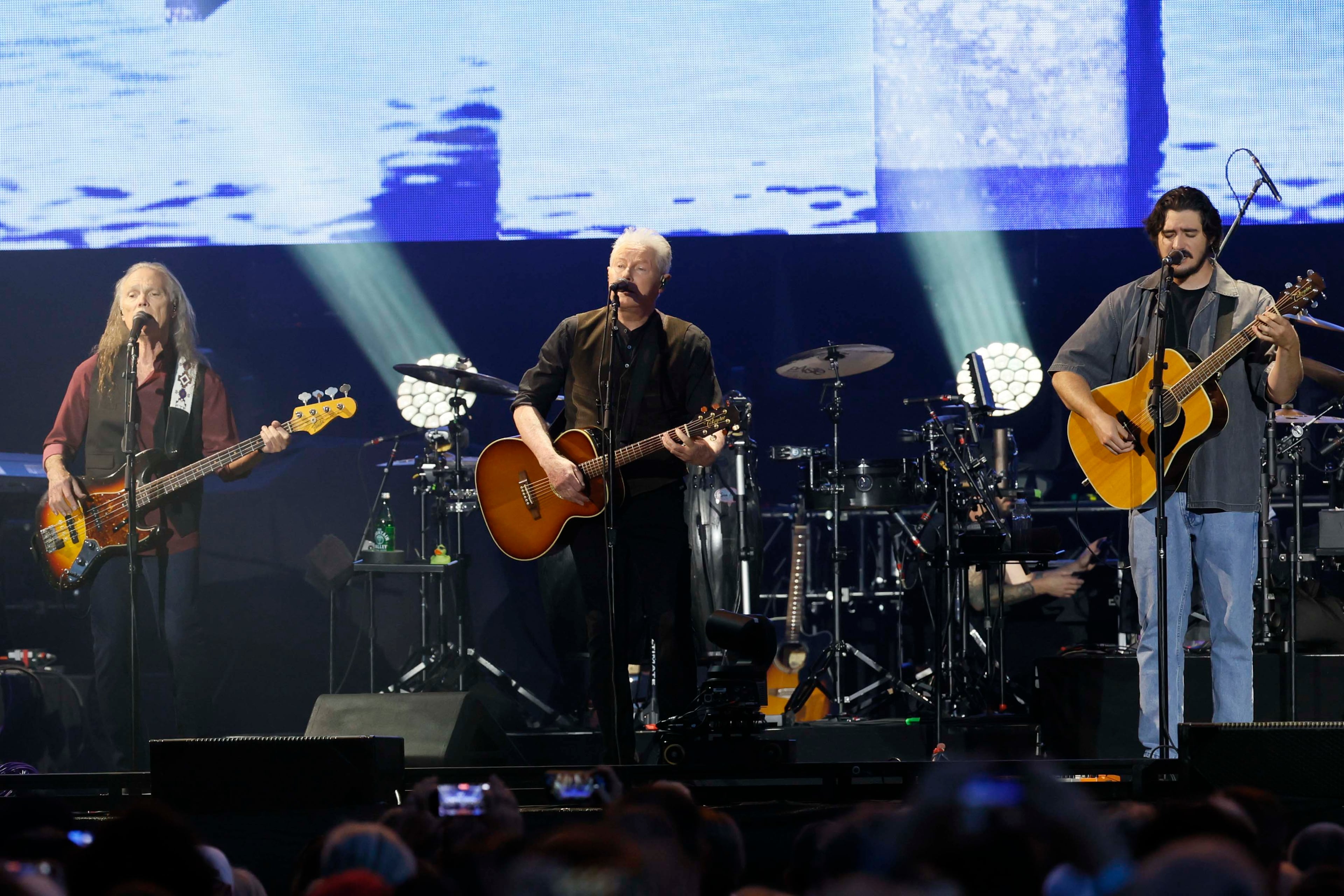 Don Henley (center), Deacon Frey (right) and Timothy B. Schmit perform during the Long Goodbye Act III tour at Truist Park. (Miguel Martinez/AJC)